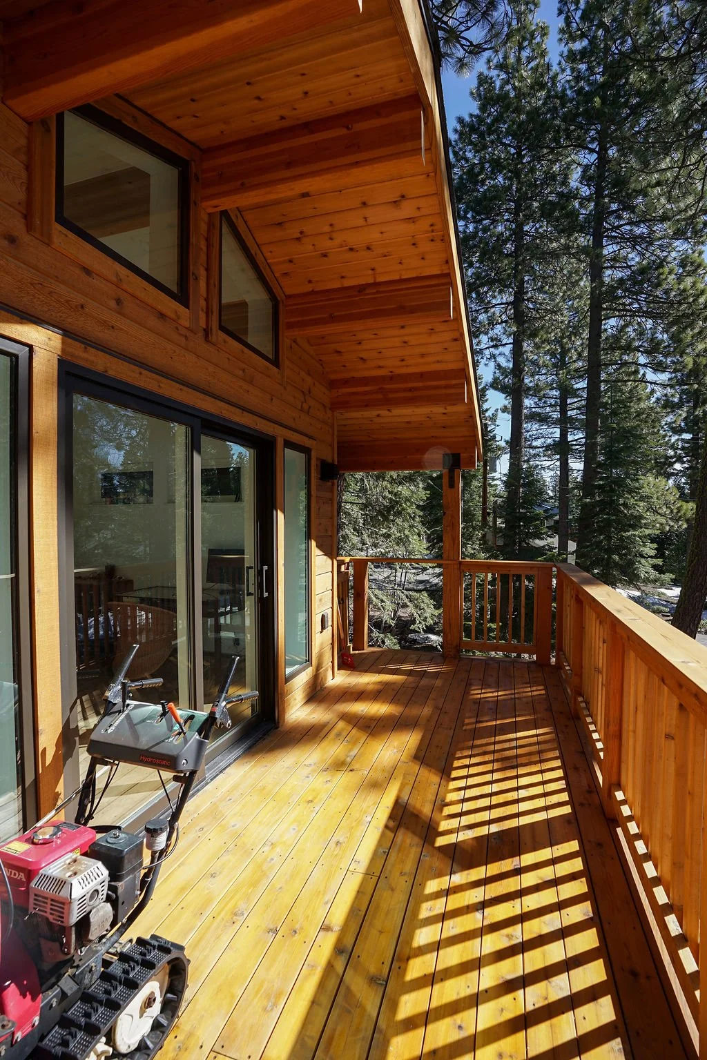 deck and railing outside bedroom with sliding glass doors