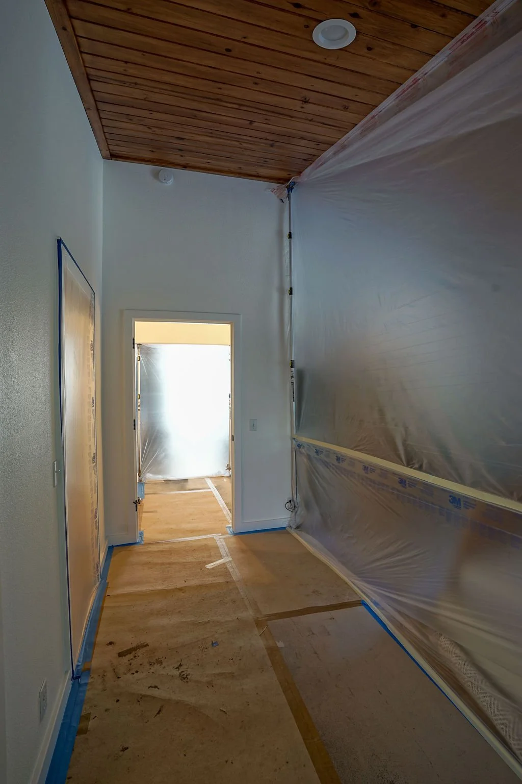 hallway with plastic wall protection
