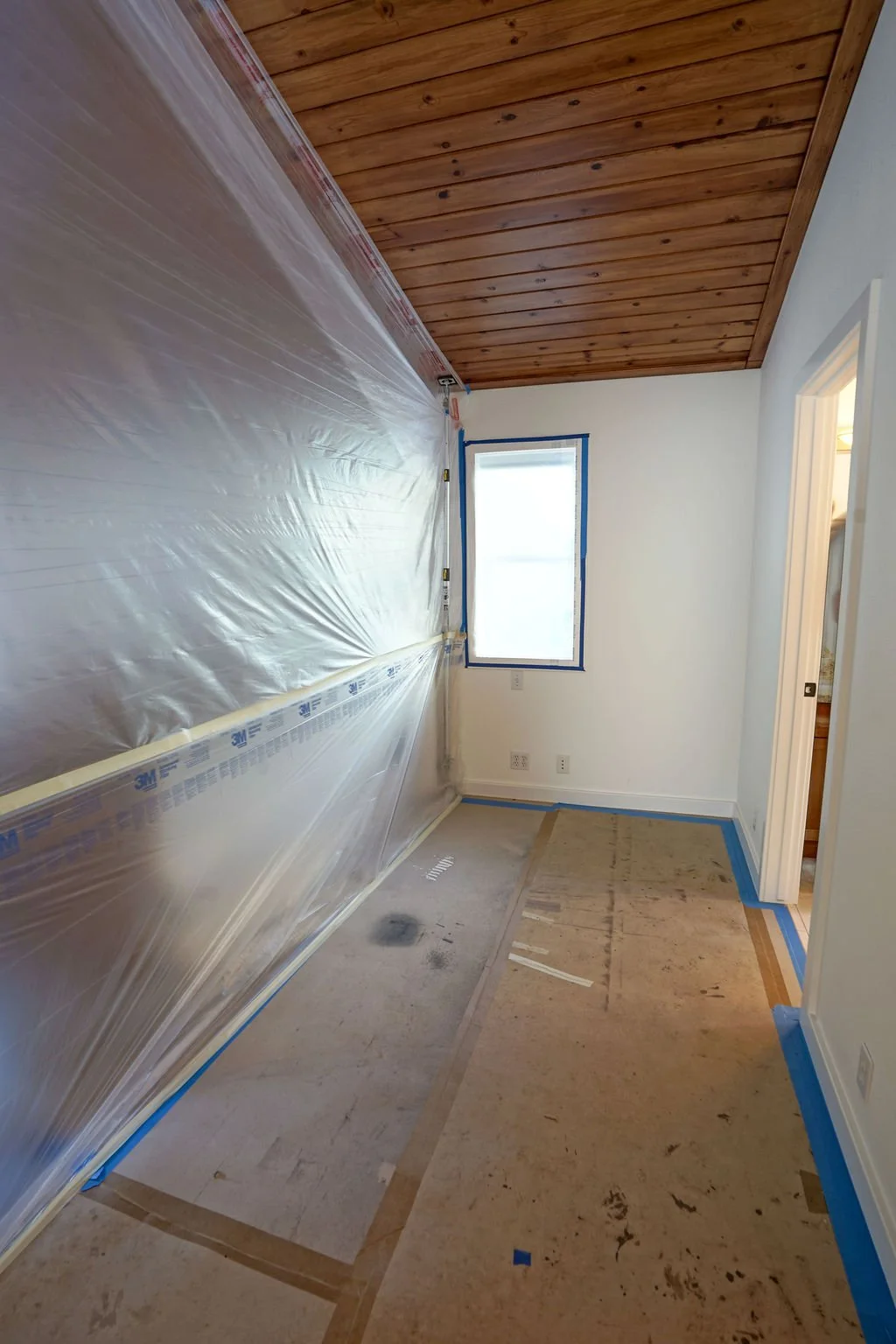 room with plastic protection on one side