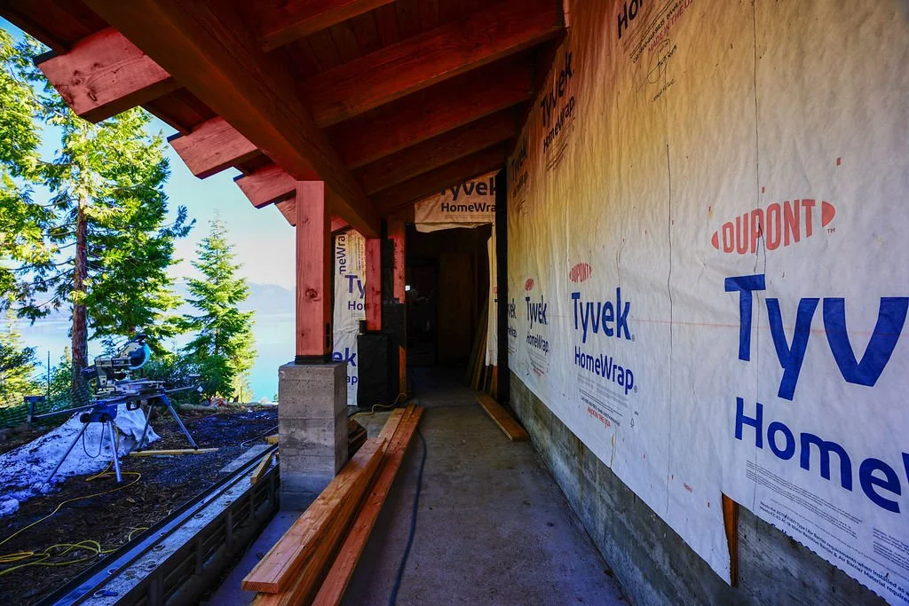 covered entry way to home with tyvek siding
