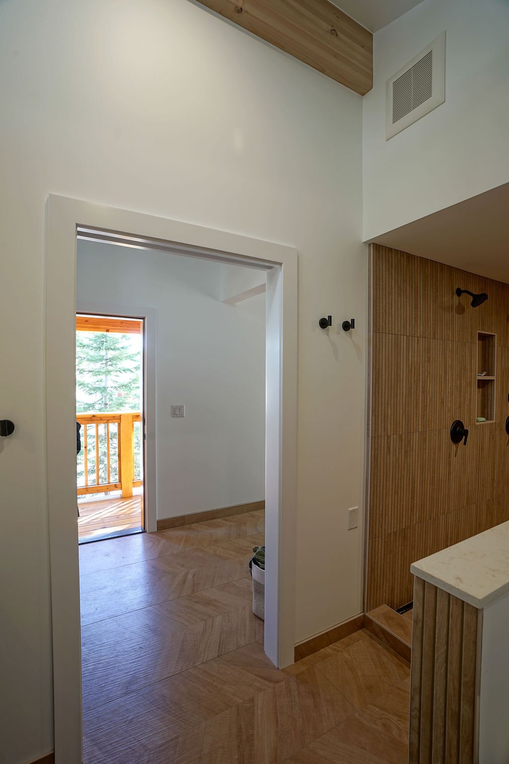 looking out door from bathroom with high ceilings