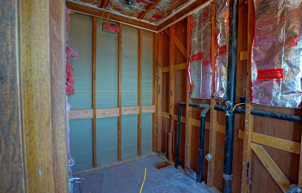 interior framing with pipes and insulation