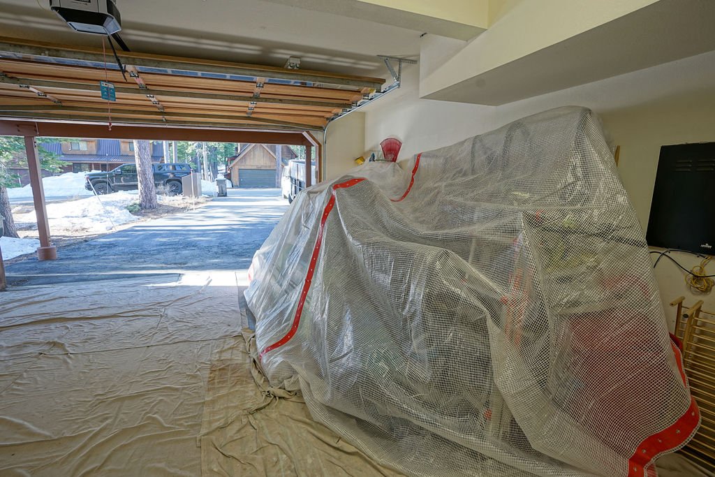 items covered with plastic in garage