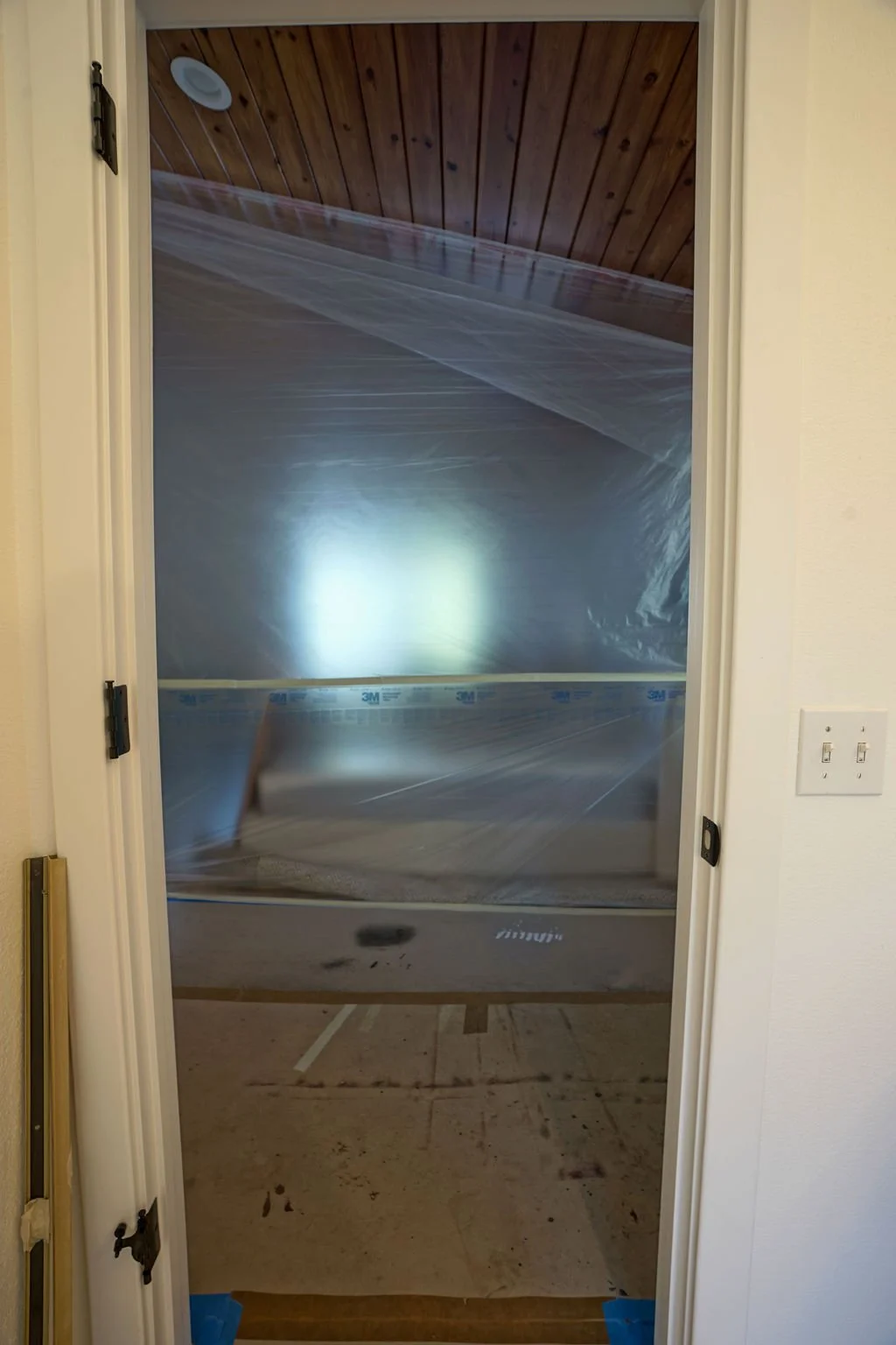 looking through a door to room with plastic