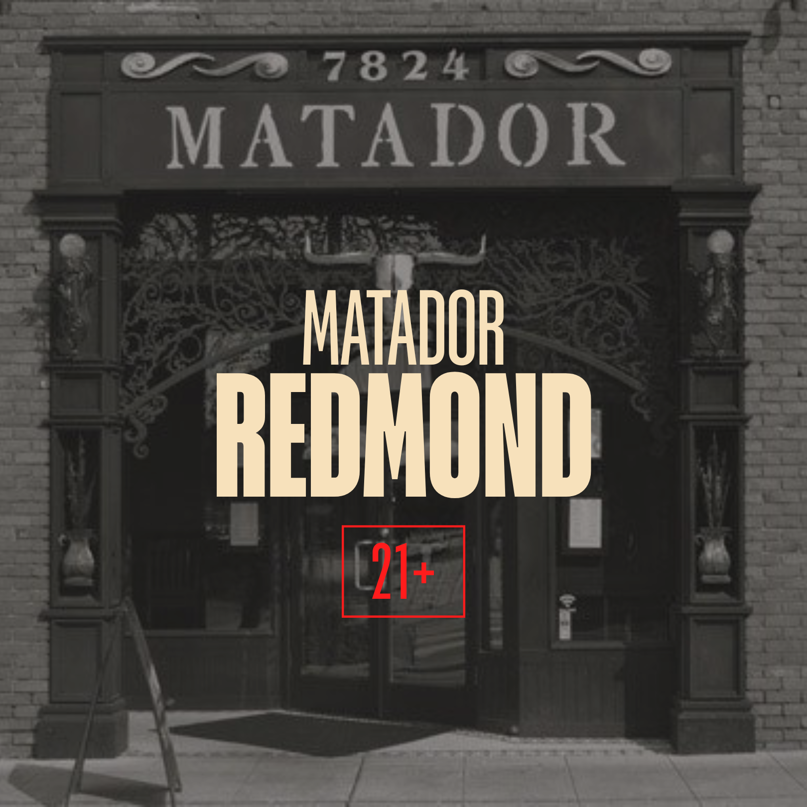 Entrance of a building named Matador with decorative wrought ironwork, brick walls, and a sign indicating an age restriction of 21+.