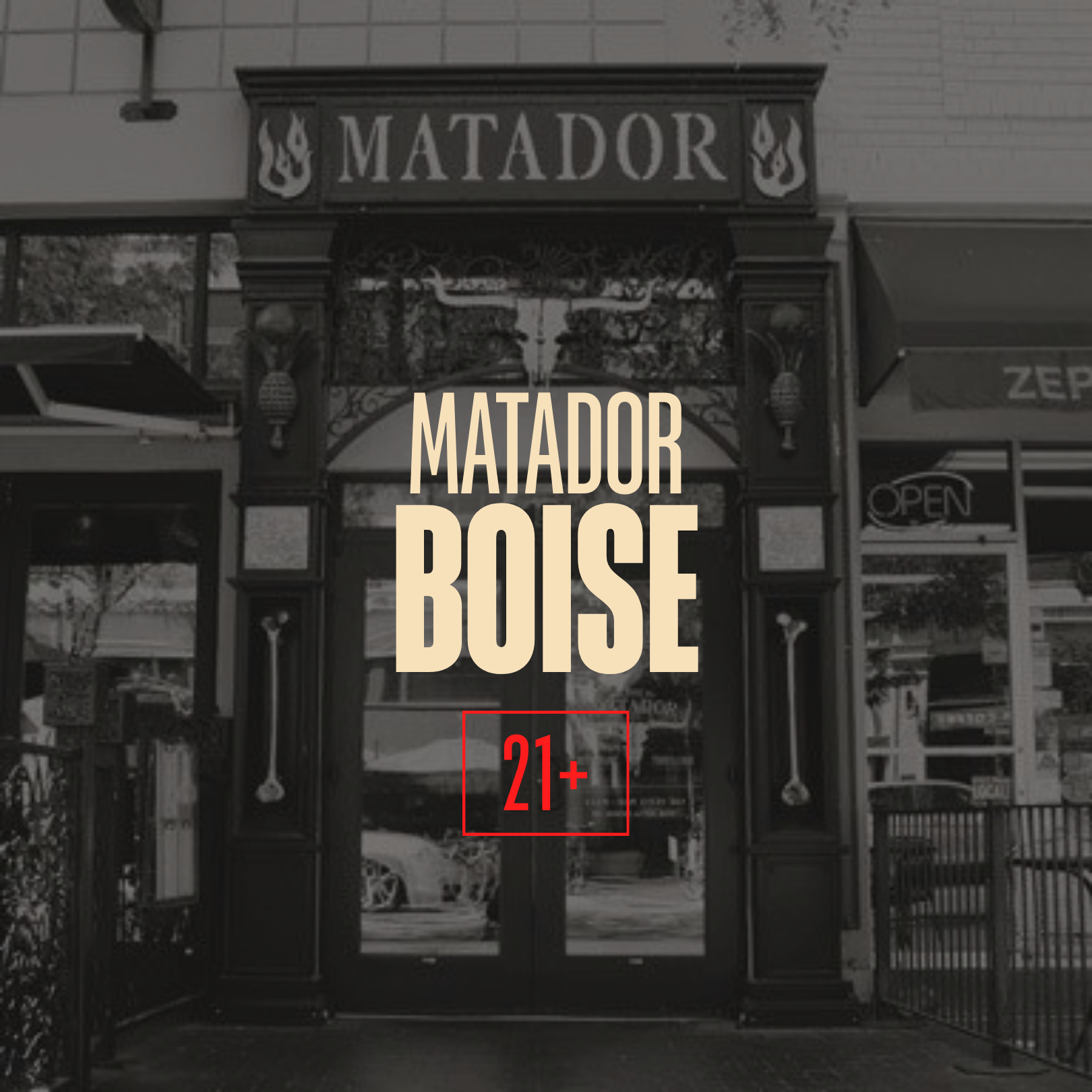 Exterior of a bar or restaurant named Matador Boise, with decorative black ironwork and signage, and an 'Open' sign in the window