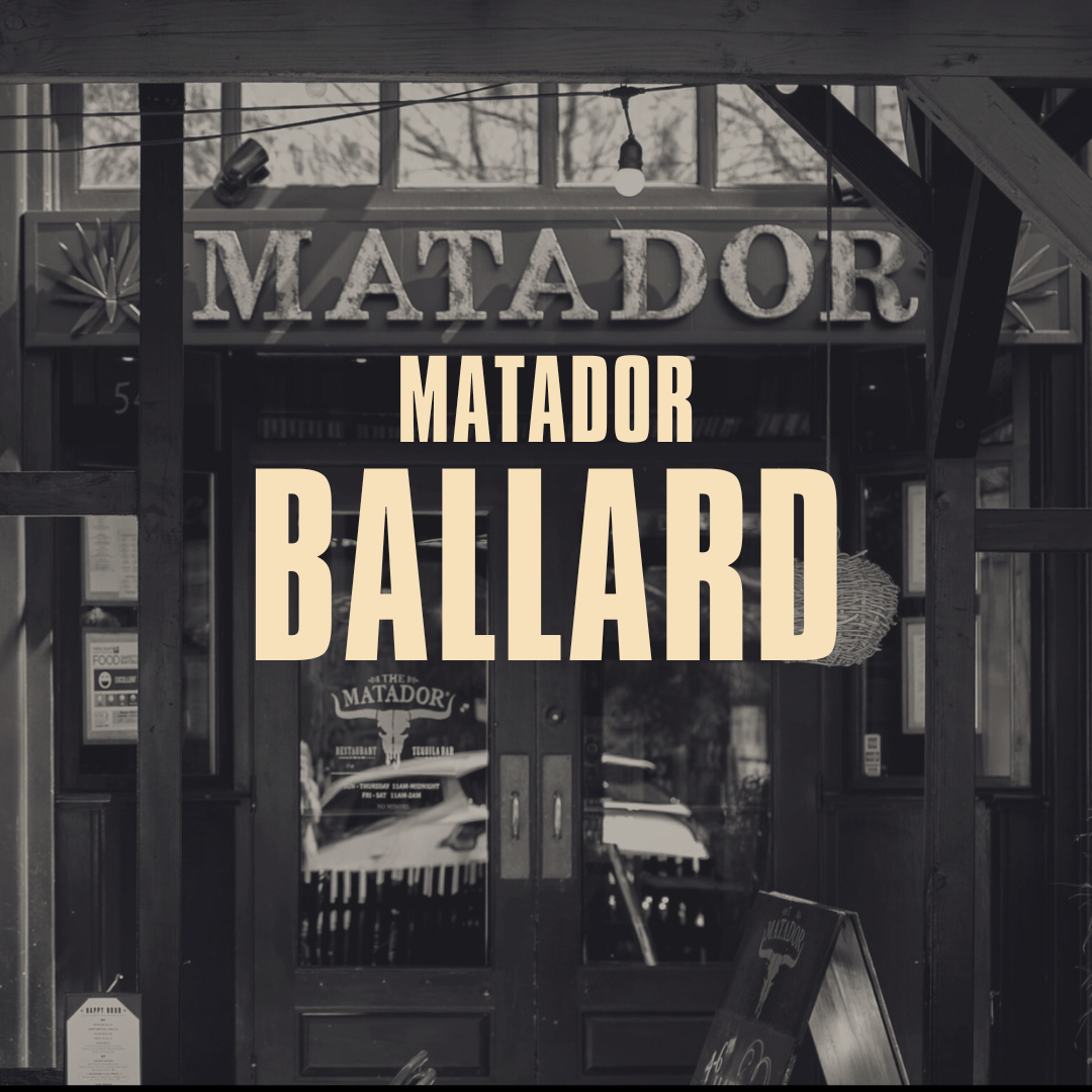 Black and white photo of the entrance to a restaurant called 'The Matador'. Large sign with the words 'MATADOR BALLARD' in front of the restaurant entrance.