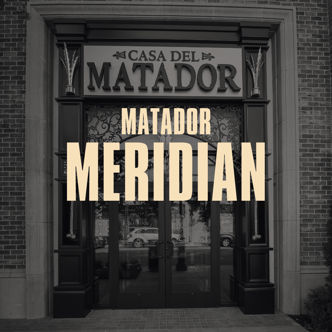 The entrance of Casa del Matador, a restaurant or establishment with decorative black and glass doors, sign with the name 'Casa del Matador' above the door, and a large overlay text that reads 'Matador Meridian'.