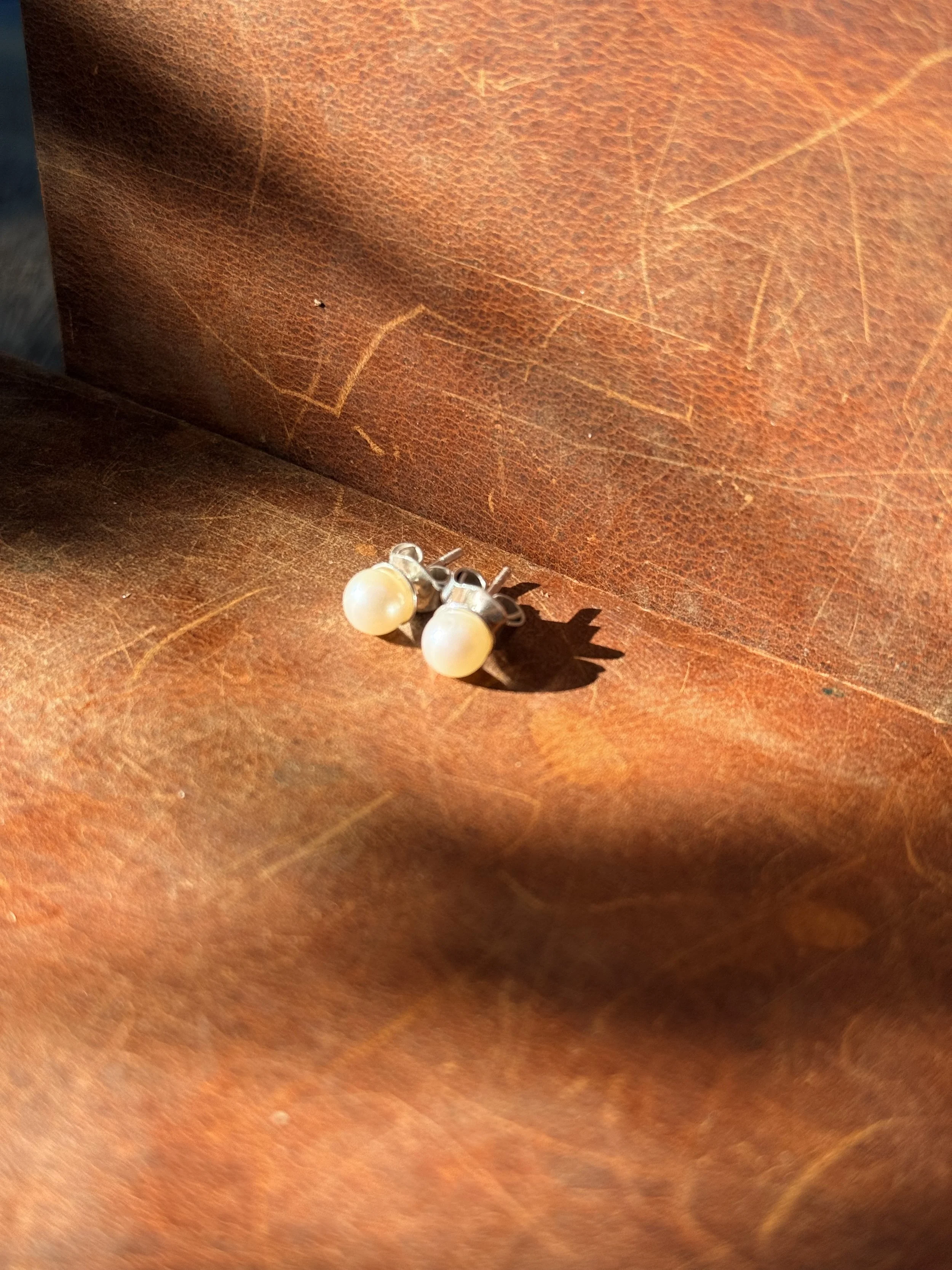 Pearl earrings - sterling silver. All pieces hand fabricated including butterfly earring backs, pearl cups, and posts. 