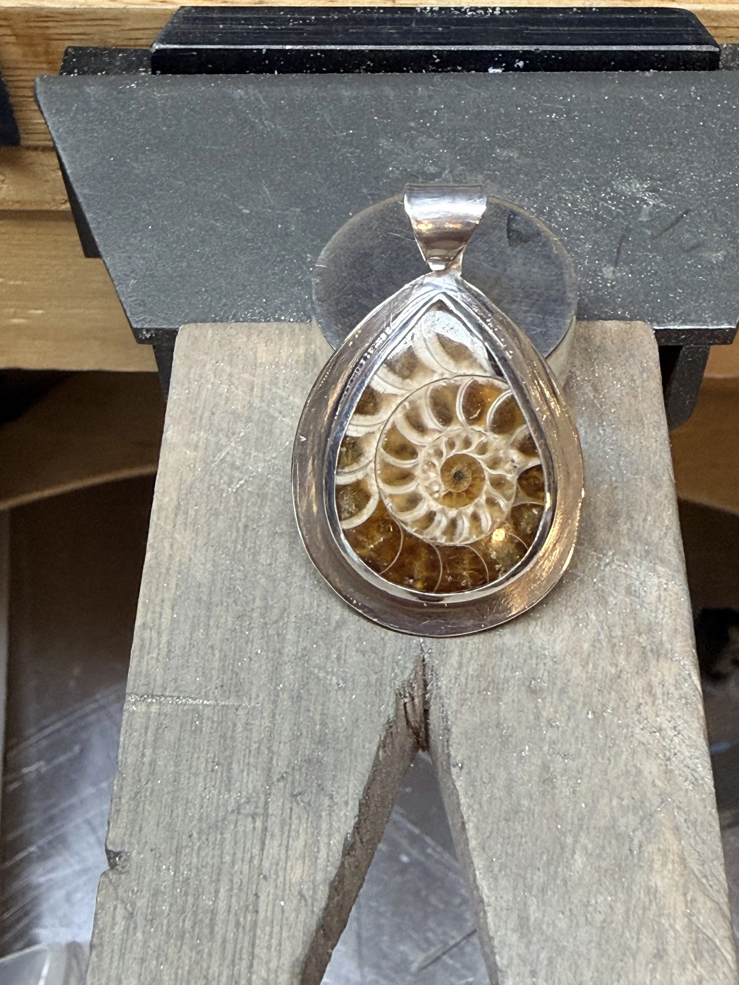 Sterling silver ammonite fossil pendant.
