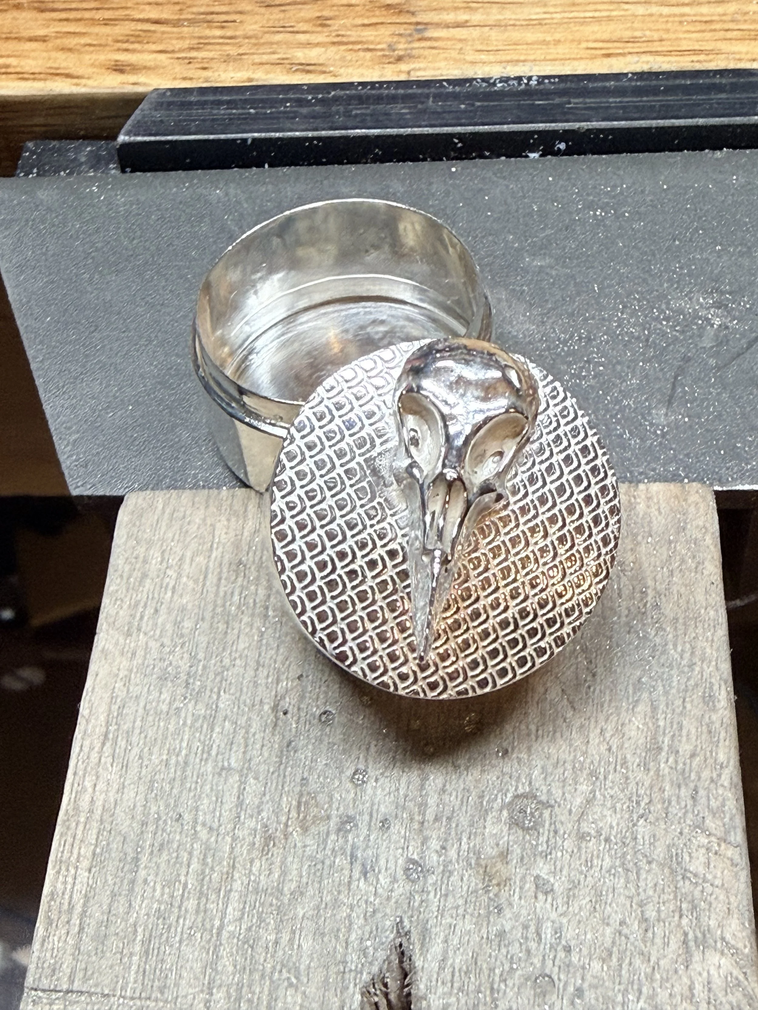 Sterling silver trinket box (aka snuff box) with patterned lid cap and PMC Silver bird skull. 