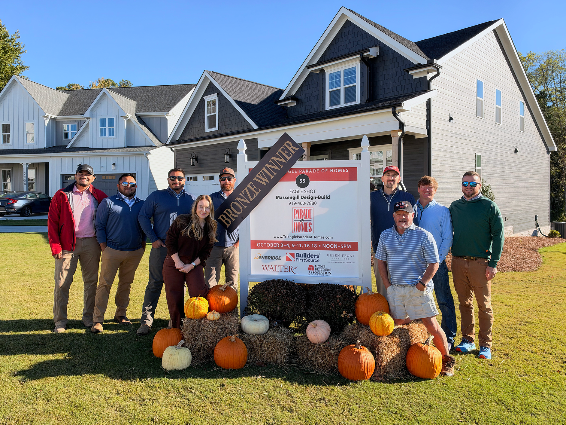 Award-Winning Custom Home Builders in Fuquay Varina - Massengill Design Build standing outside of their 2026 Triangle Parade of Homes entry that won bronze.