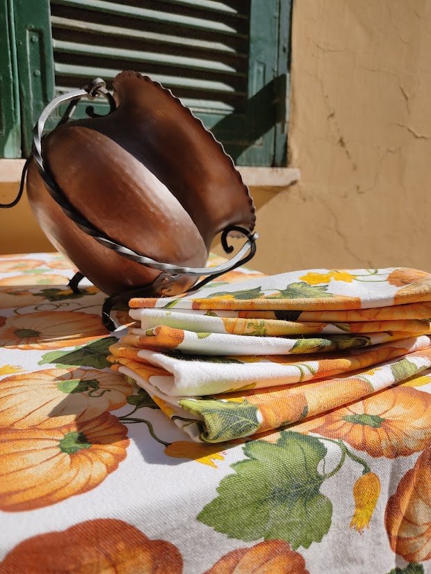 Pumpkin Motif Heavy Canvas Table Linen Set in front of green shutter