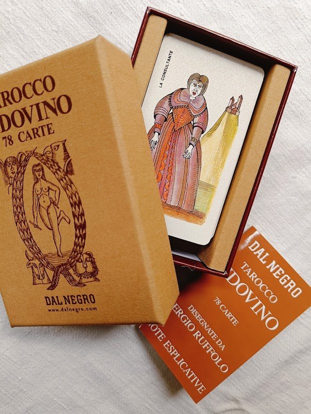 Tarot deck box, open and showing cards and instruction book