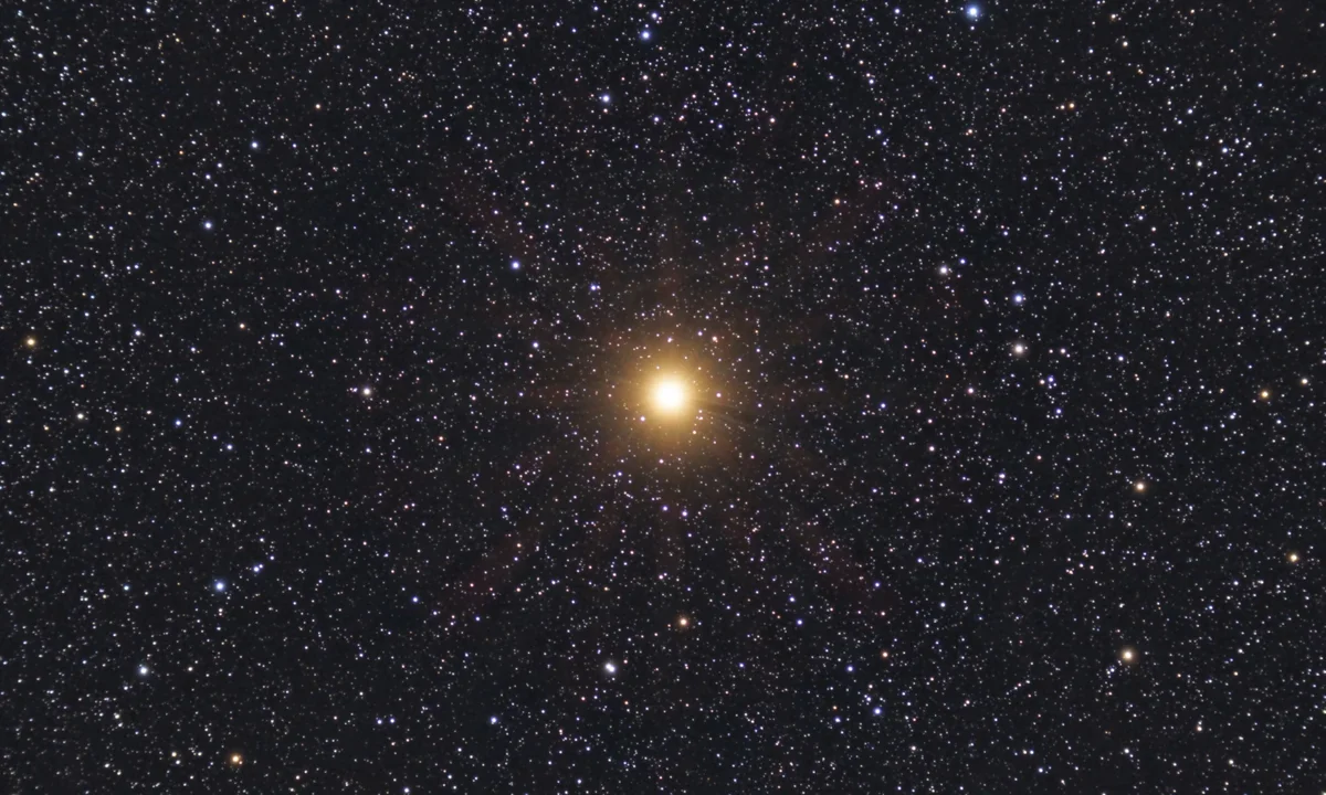 Brilliant red star Betelgeuse with many other stars visible.