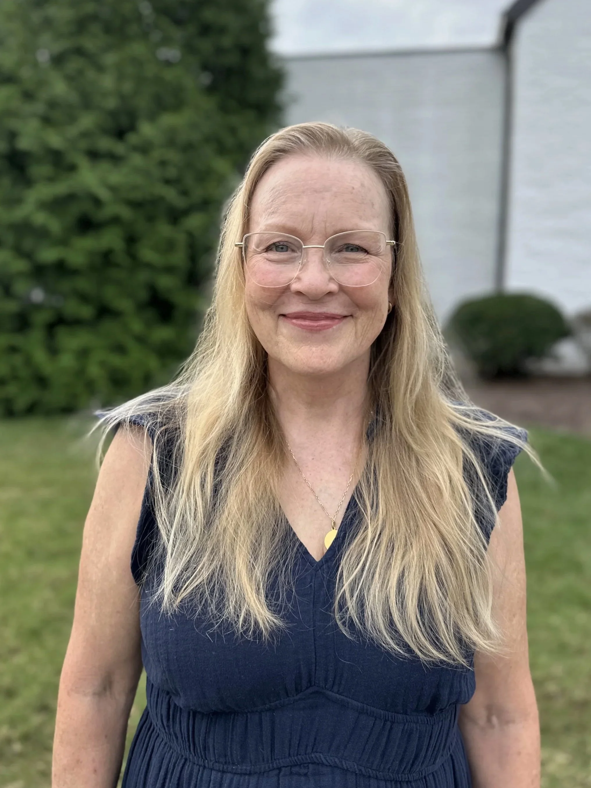 Graphic showing five intersecting white circles on a dark blue background with a white plus sign at the center.