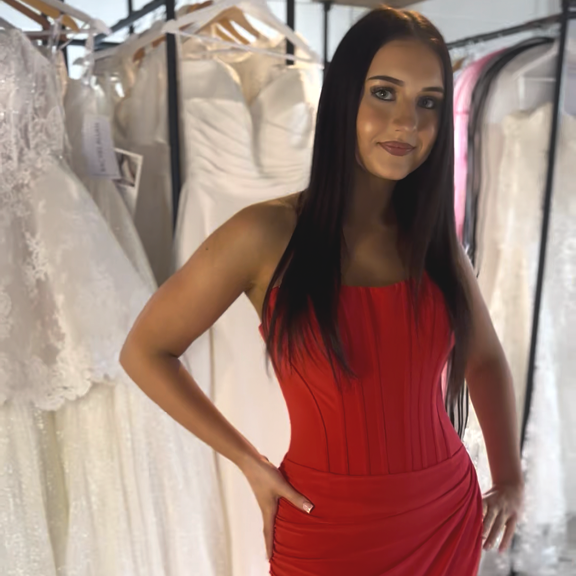 Prom girl in fitted red dress with Perfectly Sunkissed Tan