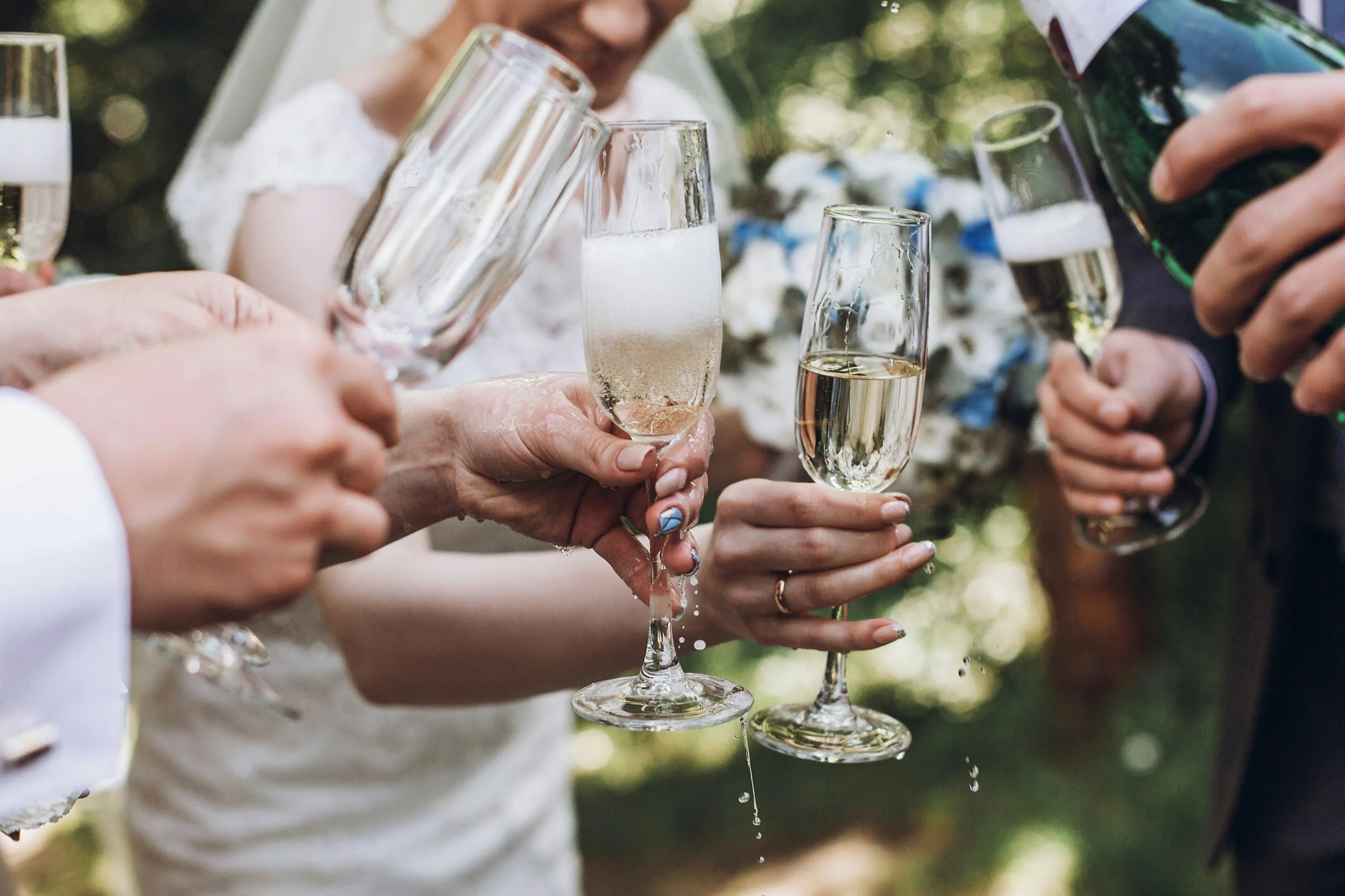 A wedding party enjoying sparkling wine