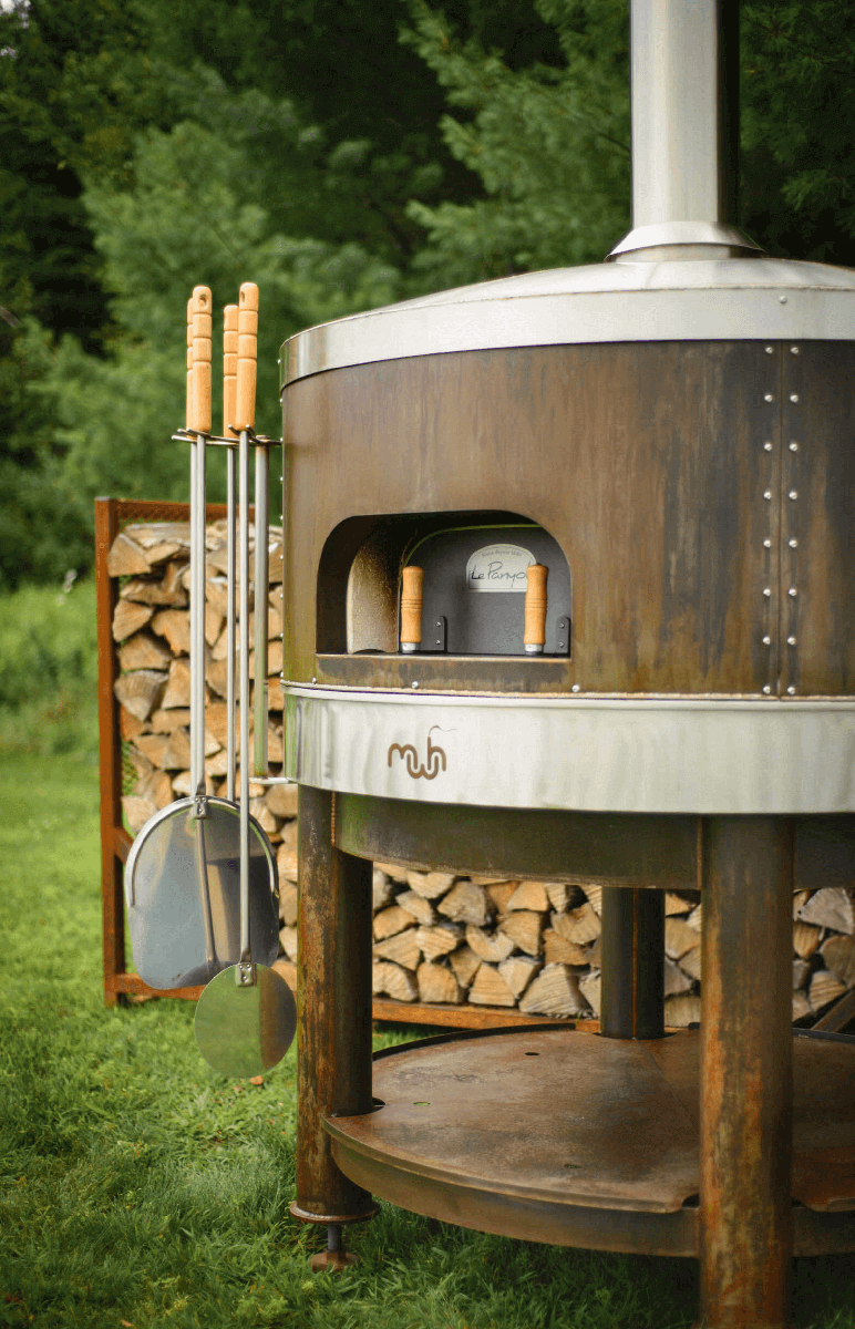 A wood-fired pizza oven for outdoor kitchen.