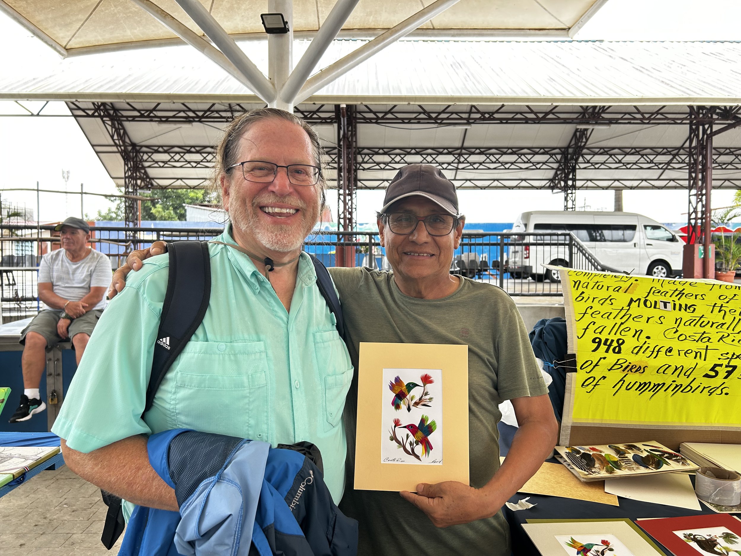 Artist who makes artwork out of feathers he collects of the jungle floor. I bought one!