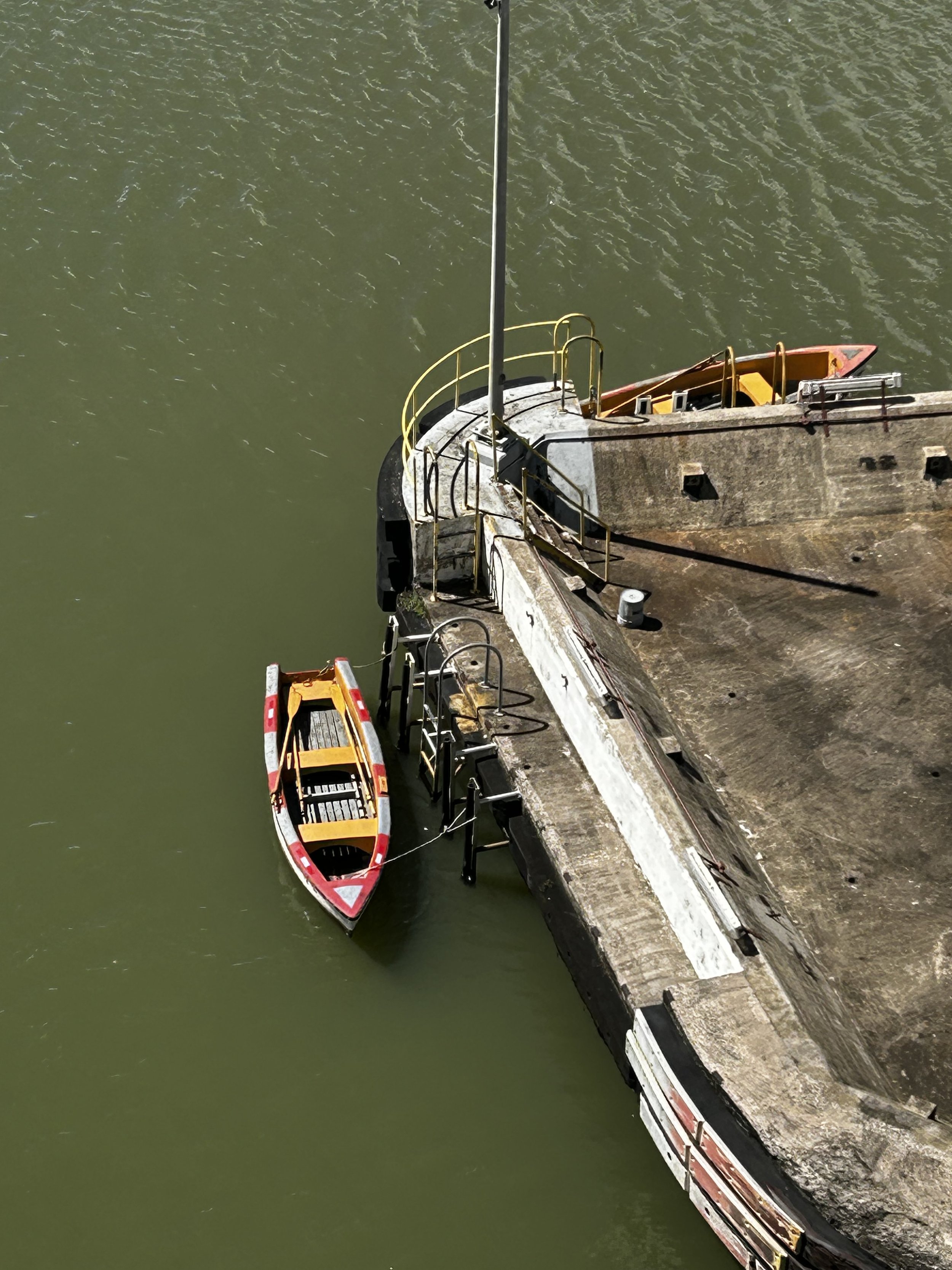 The row boat that gathers the tow line from the ship and takes it to the mule 