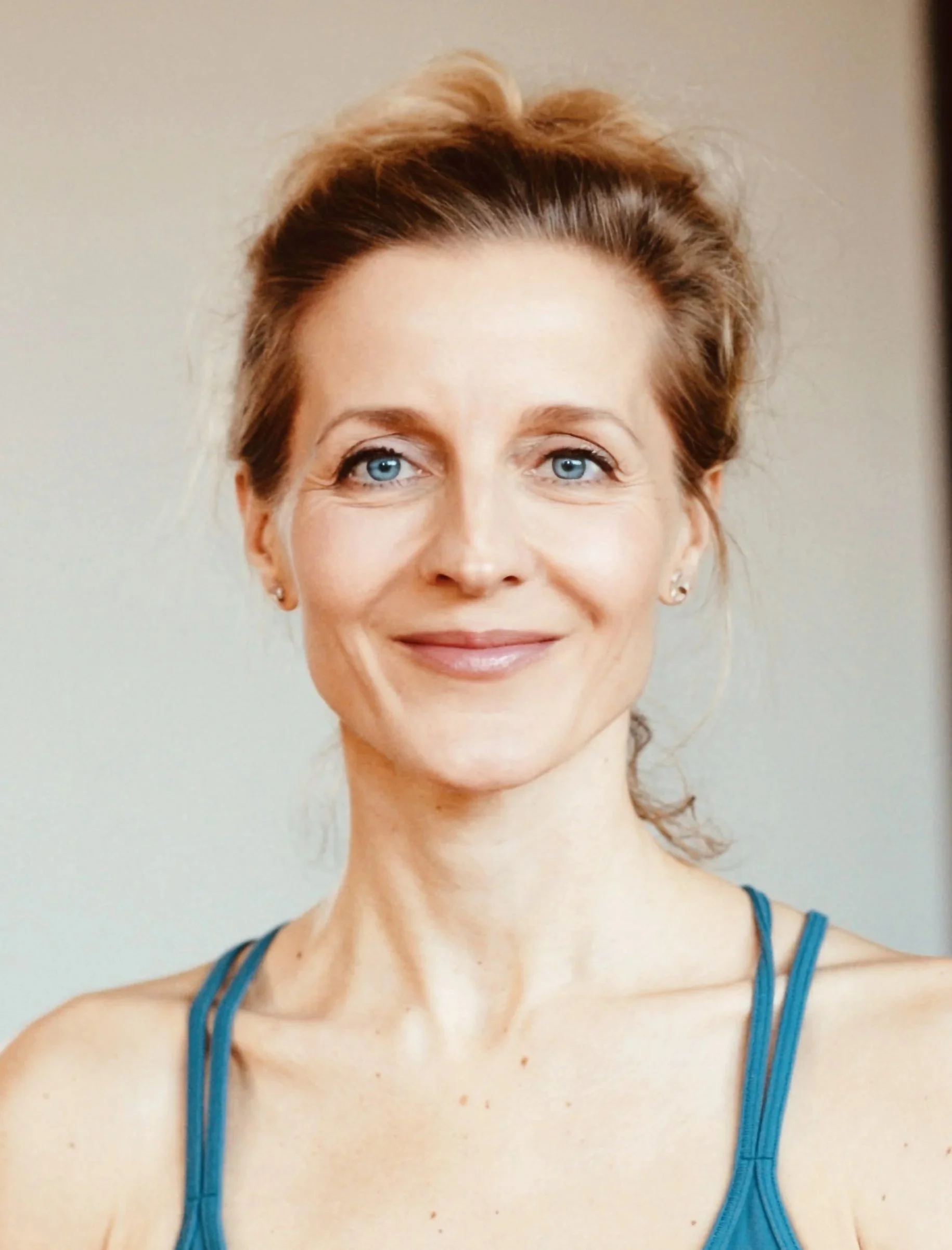 Maria Toso Blue Tank Headshot.jpg