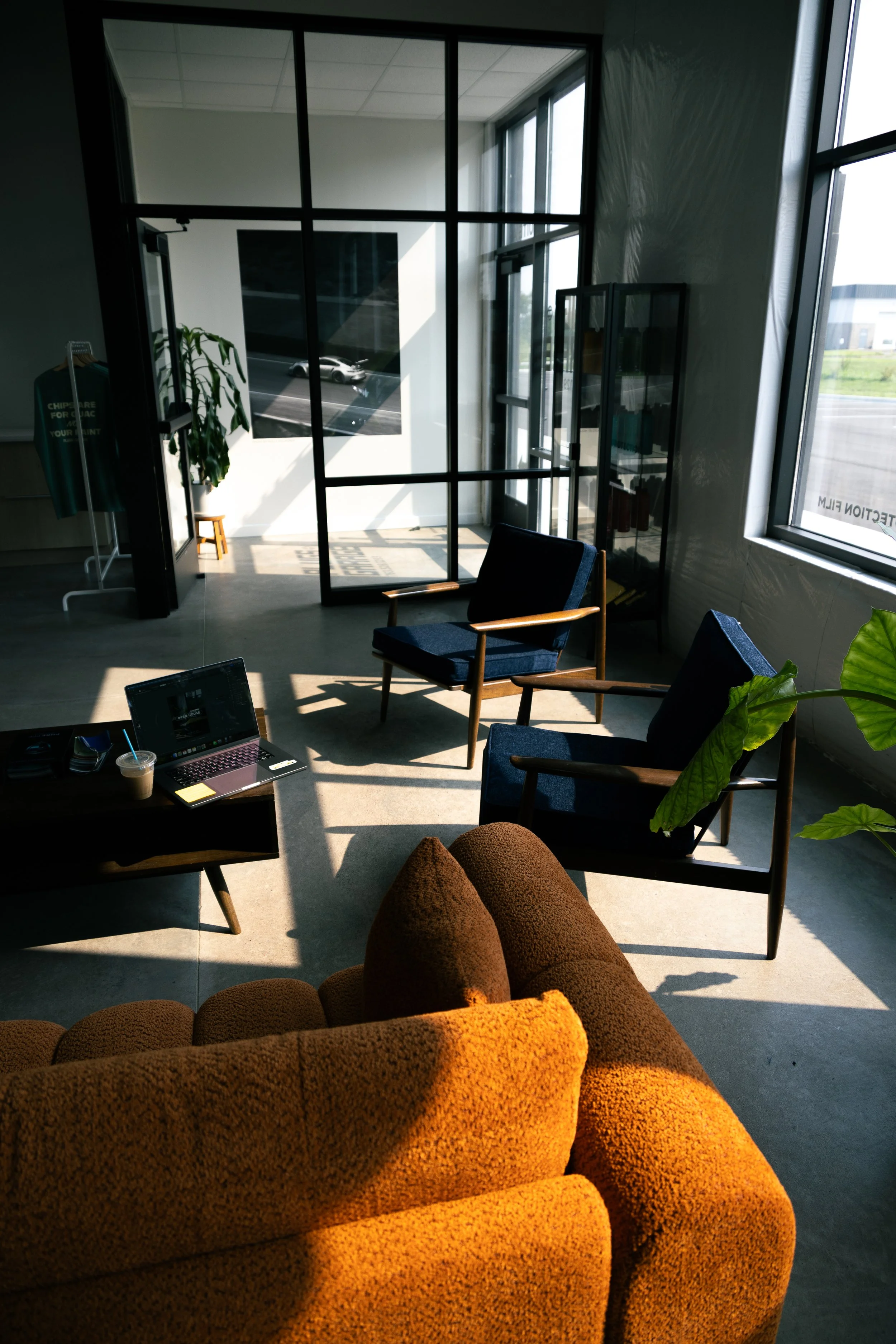 Interior of Plugs Garage, automotive shop specializing in paint protection film, commercial vehicle wraps, and automotive window tint.