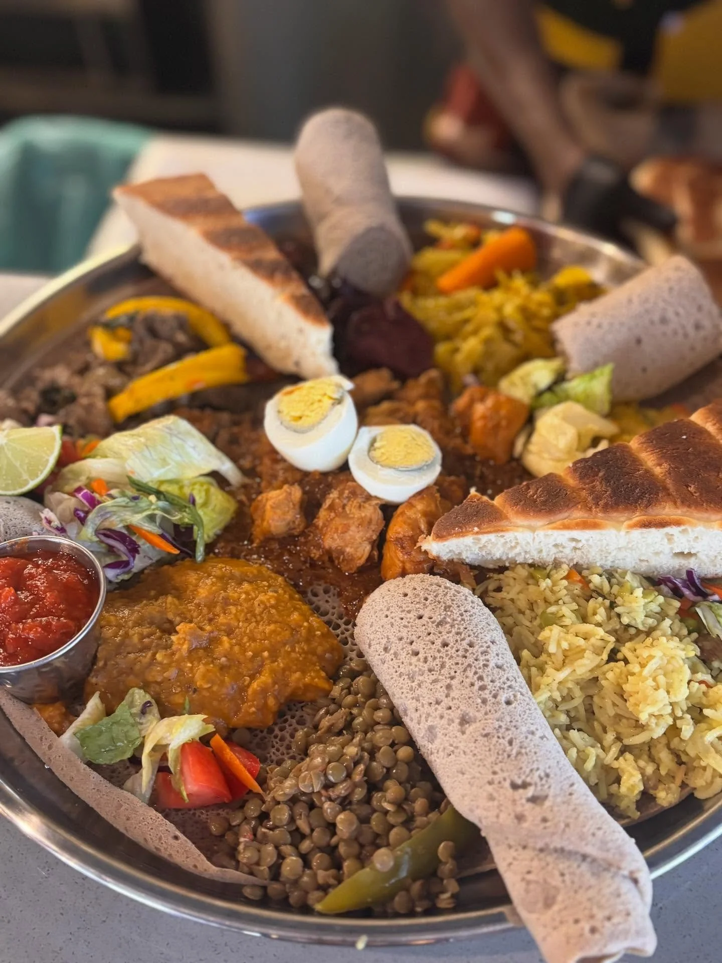 Check out this feast! Kidane and Besrat are cooking up some delicious Eritrean cuisine for lunch and dinner today! Lunch is on until 2 and dinner is 4-8 tonight.