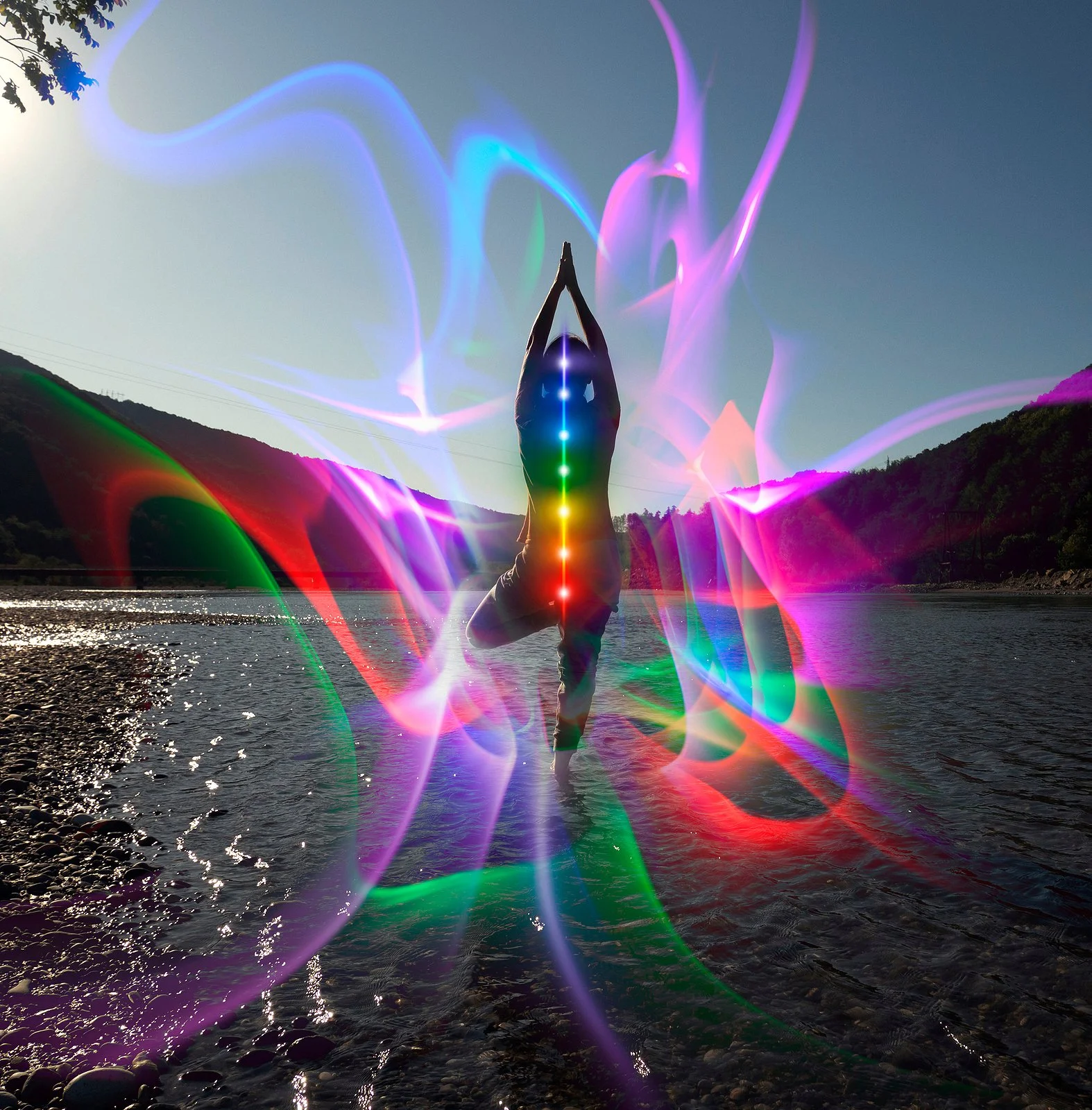 Abstract digital artwork depicting a glowing human silhouette surrounded by dynamic light bursts and abstract energy lines, symbolizing technology and consciousness.