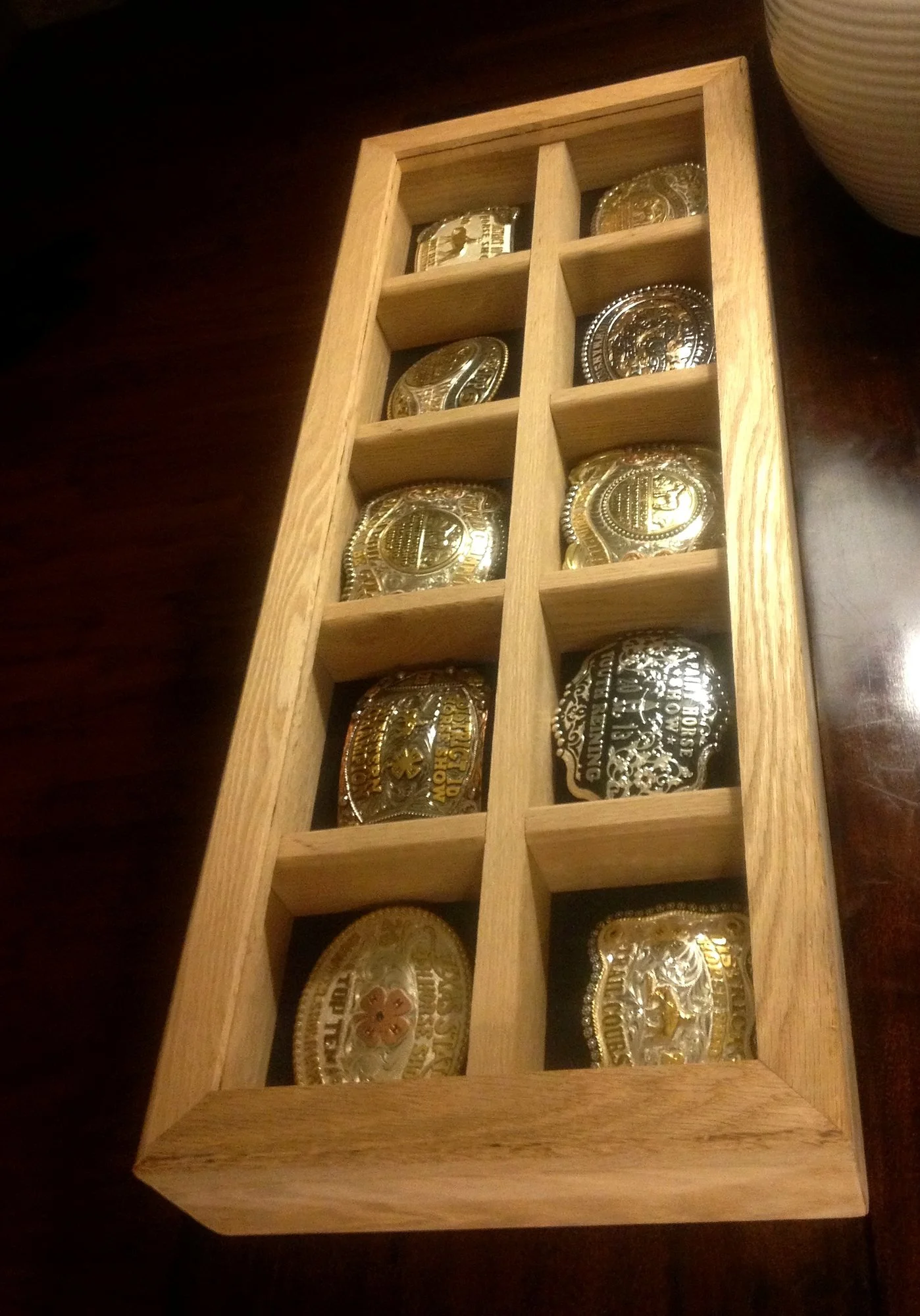 Display case for championship belt buckles