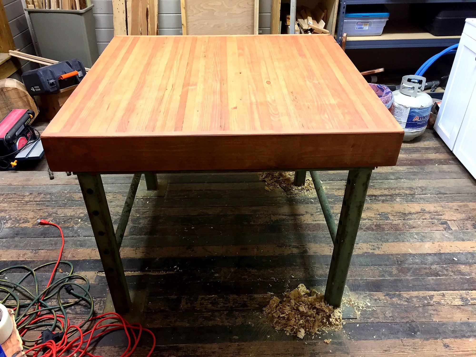 Butcher-block table on a steel base
