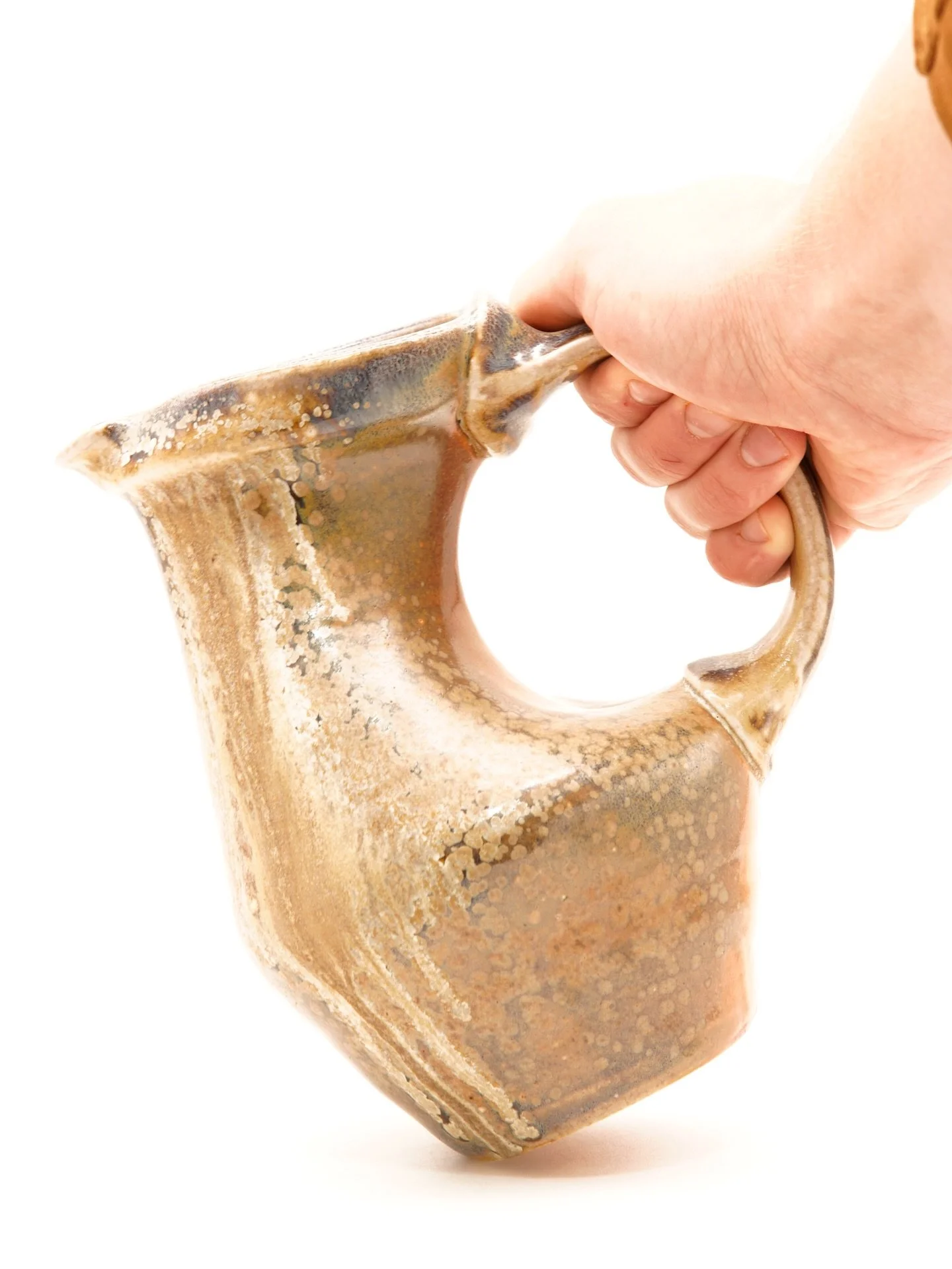 🪵🔥Wood-Fired Pitcher. Experimenting with darting on forms.  The handle is a bit too extended for my liking, but fortunately got some good surface action. What do you think?
#woodfire #woodfirepottery #functional #ceramics #pottery