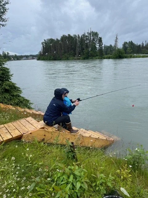 Parent and Child Fishing in the Rain.jpg