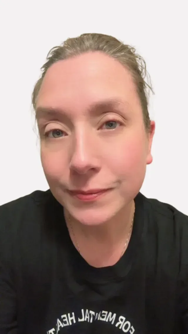 Logo for Bloom Psychotherapy with a centered dandelion flower and seeds blowing away, surrounded by the text 'Where healing takes root, transformation happens'.