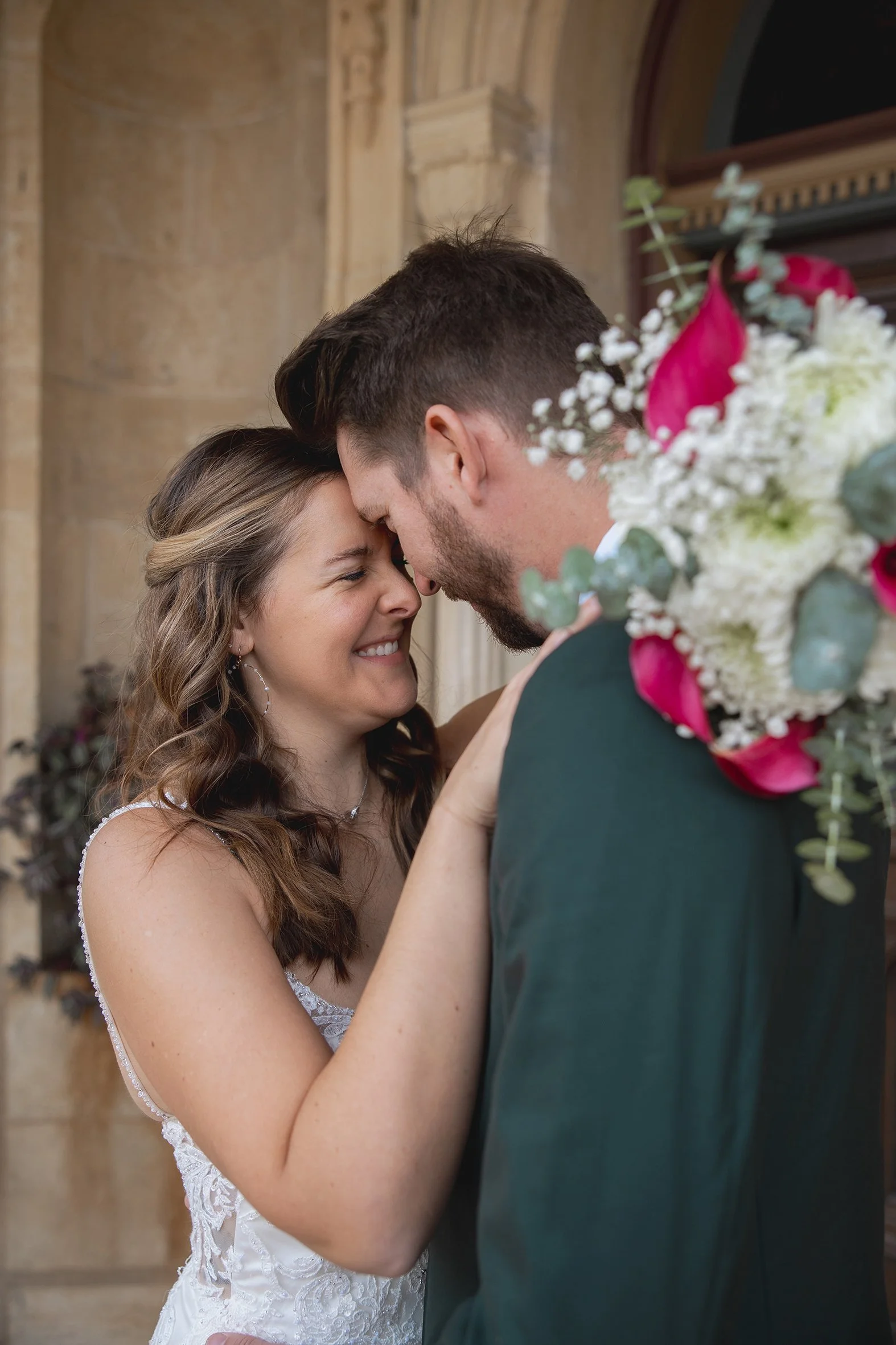 Bride and groom laughing together