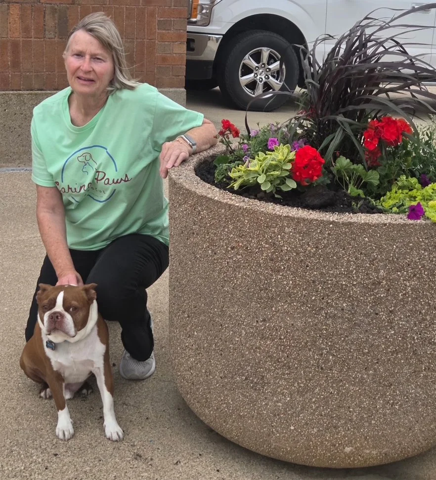 CPR volunteer Lorinda with her pup Rusty at the flower bed they sponsored in Alta (under Caring Paws Rescue's name)!