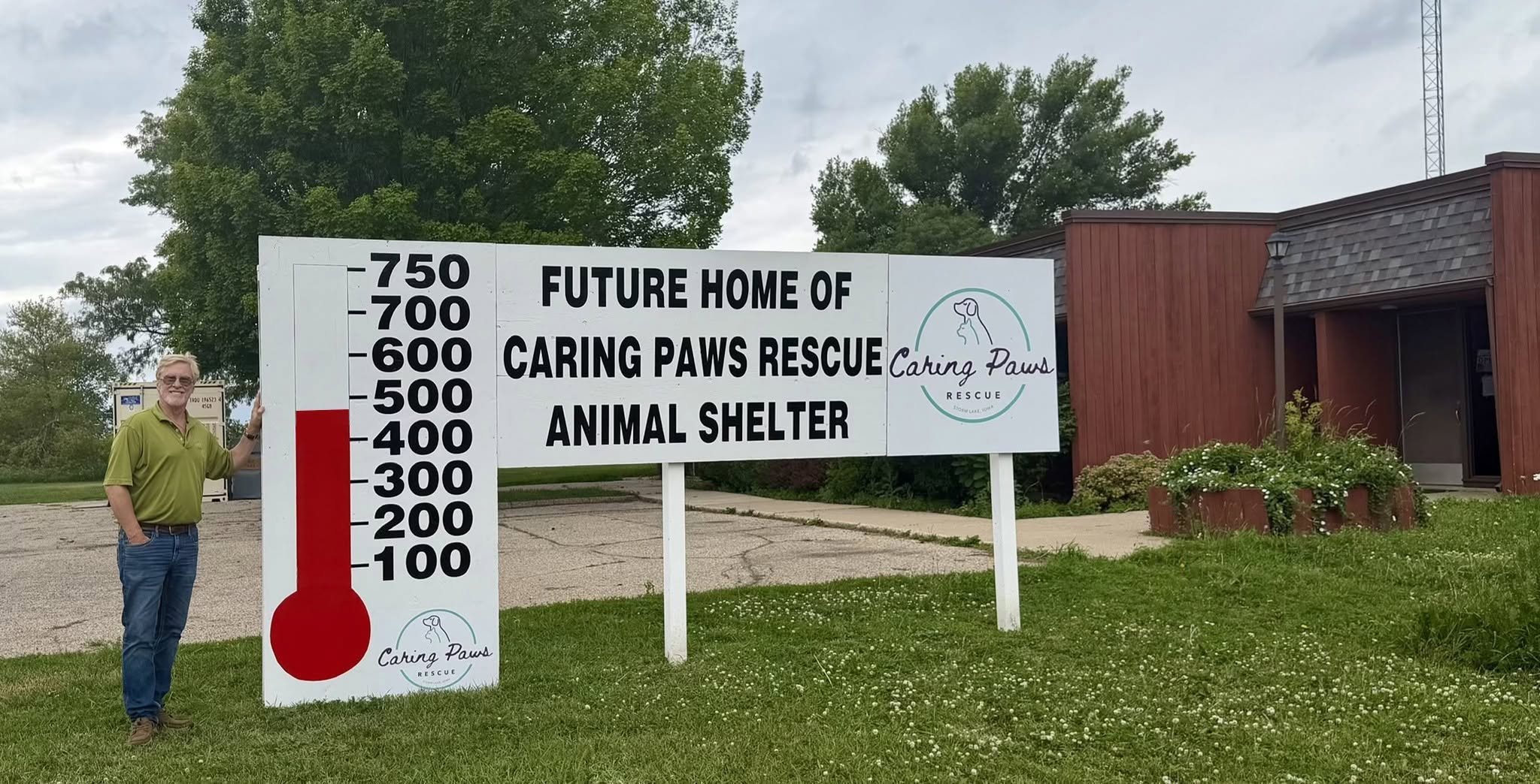 CPR member Dr. Dave Archer next to the fundraising thermometer outside of CPR's future home!