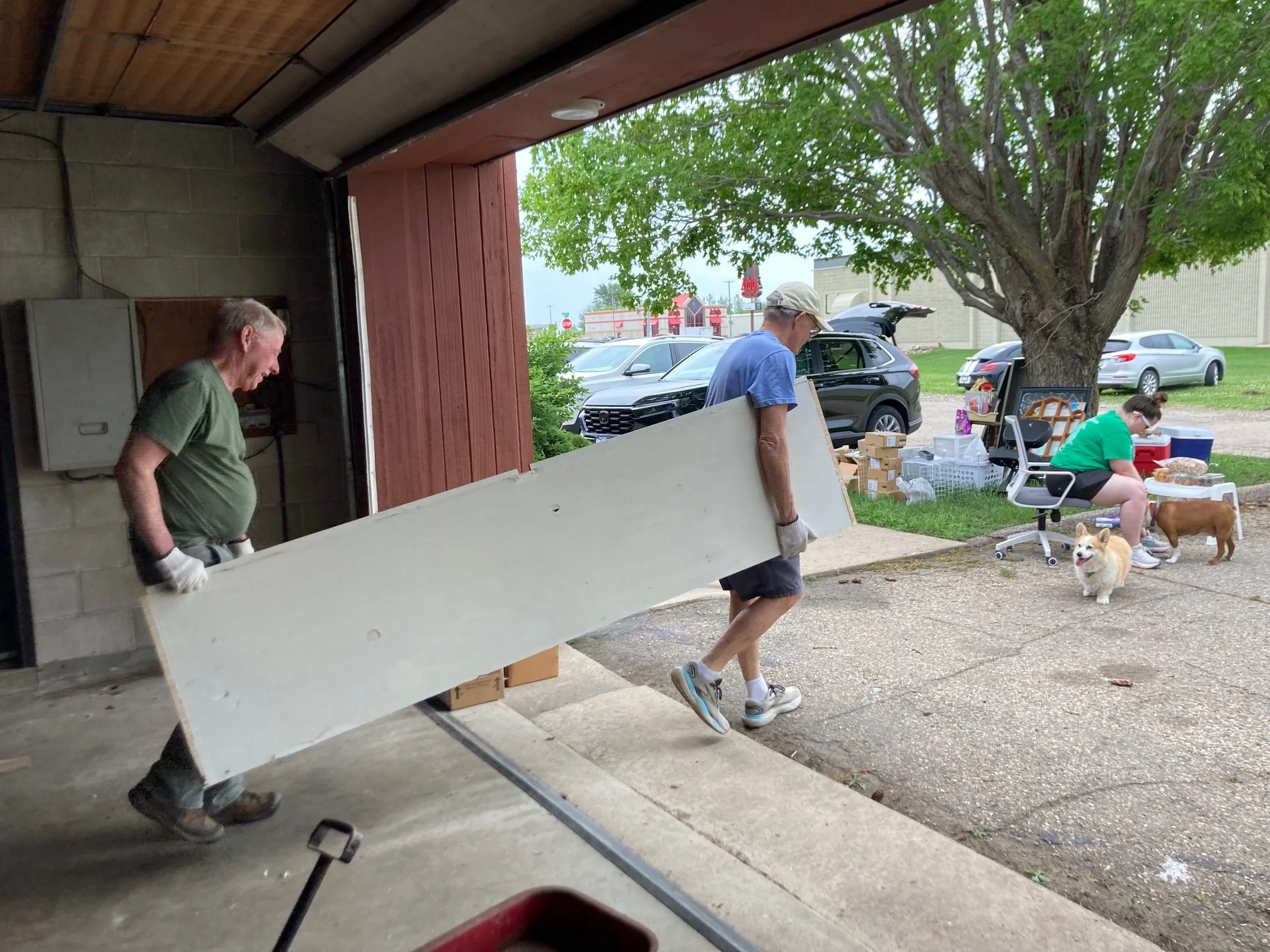 Jeff Stark and Ken Schweller, CPR members, carrying out a heavy shelf from our building during the cleanout! 