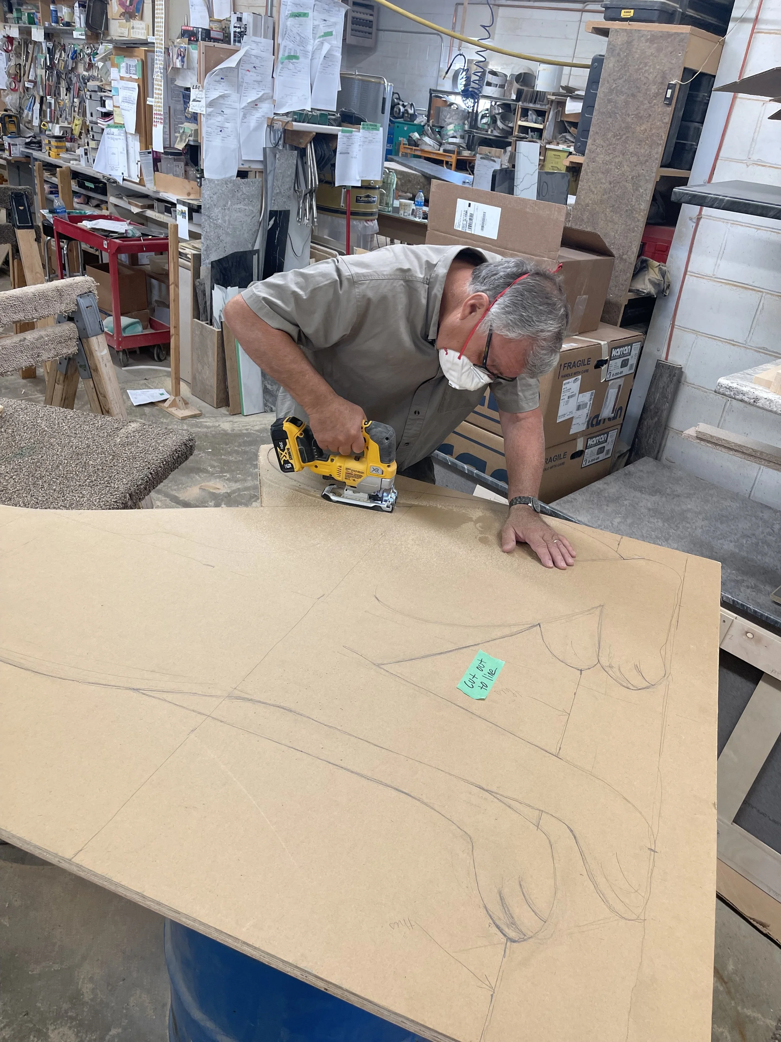 Leo Schimmer of Leo's Kitchens cutting our the CPR dog prop!