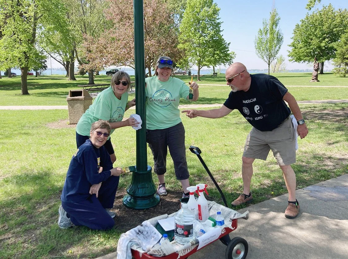 CPR members paint local park light poles during a community cleanup day!