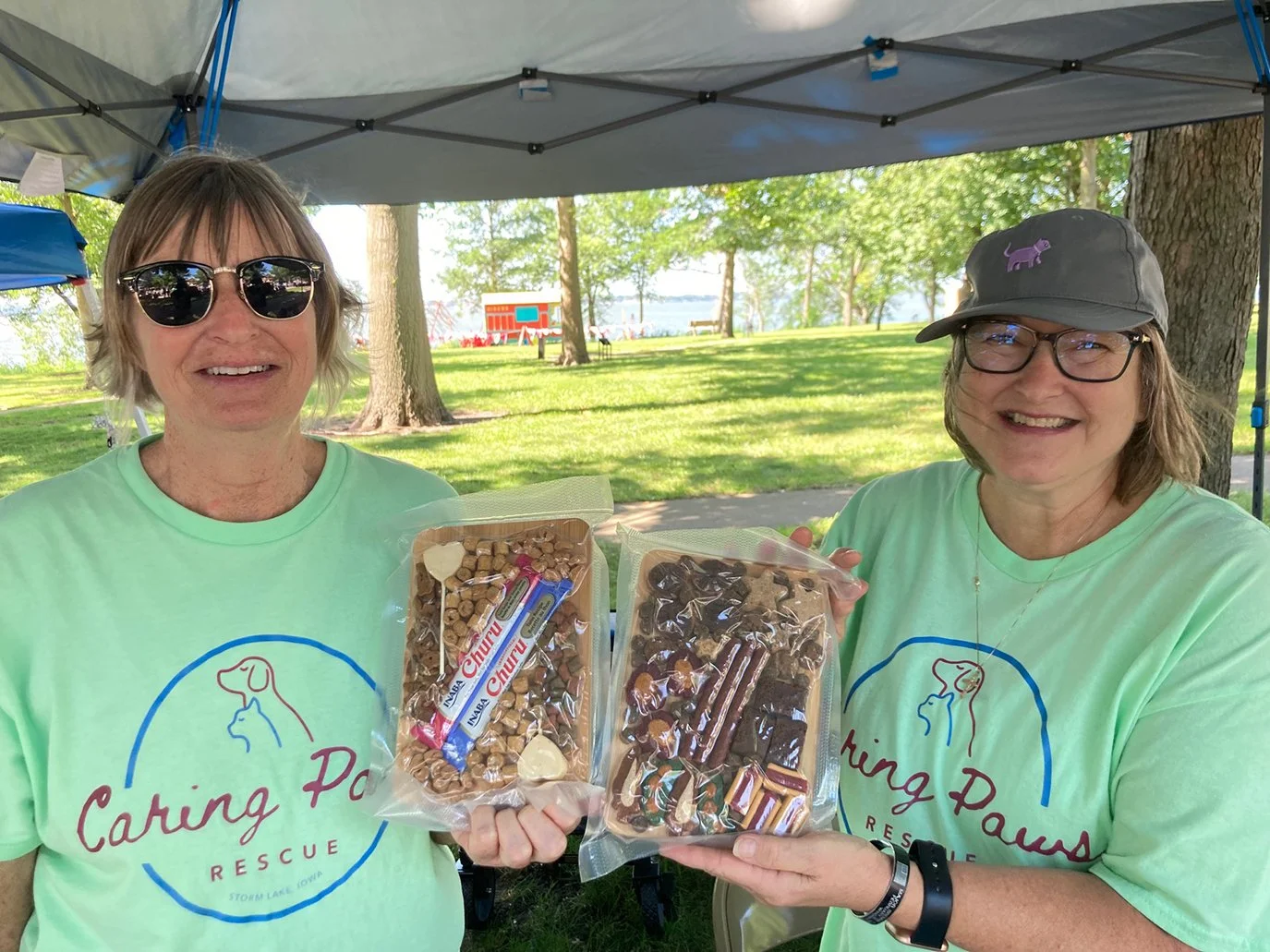 CRP members Lorinda Peterson (left) and Beth Dawson (right) sell cat and dog charcuterie boards!