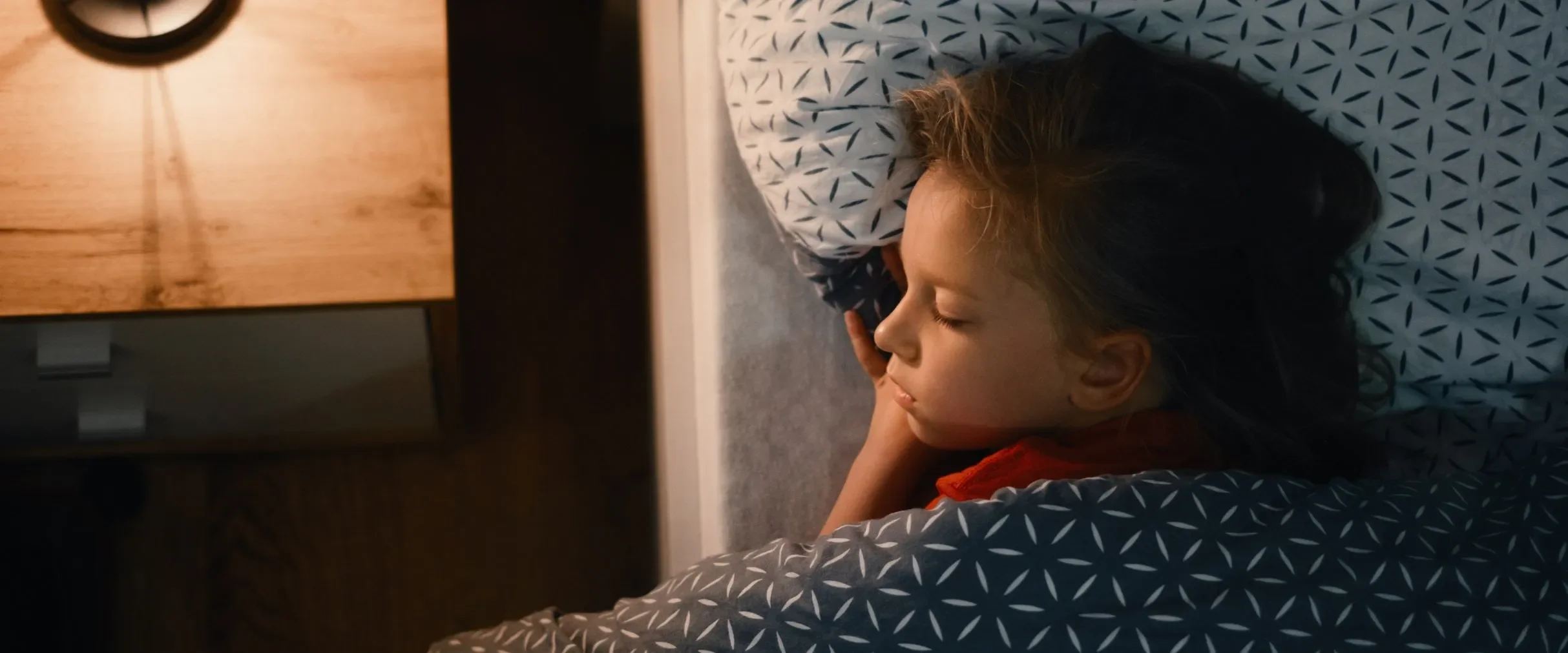 Child sleeping in bed safely
