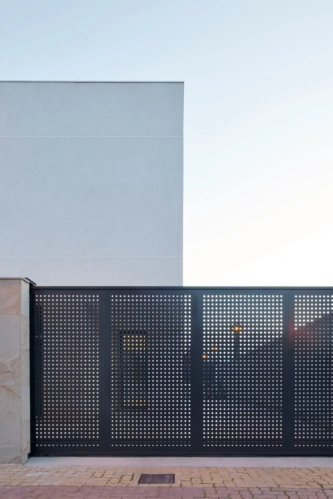 Black minimalist gate with transparent panels.jpg