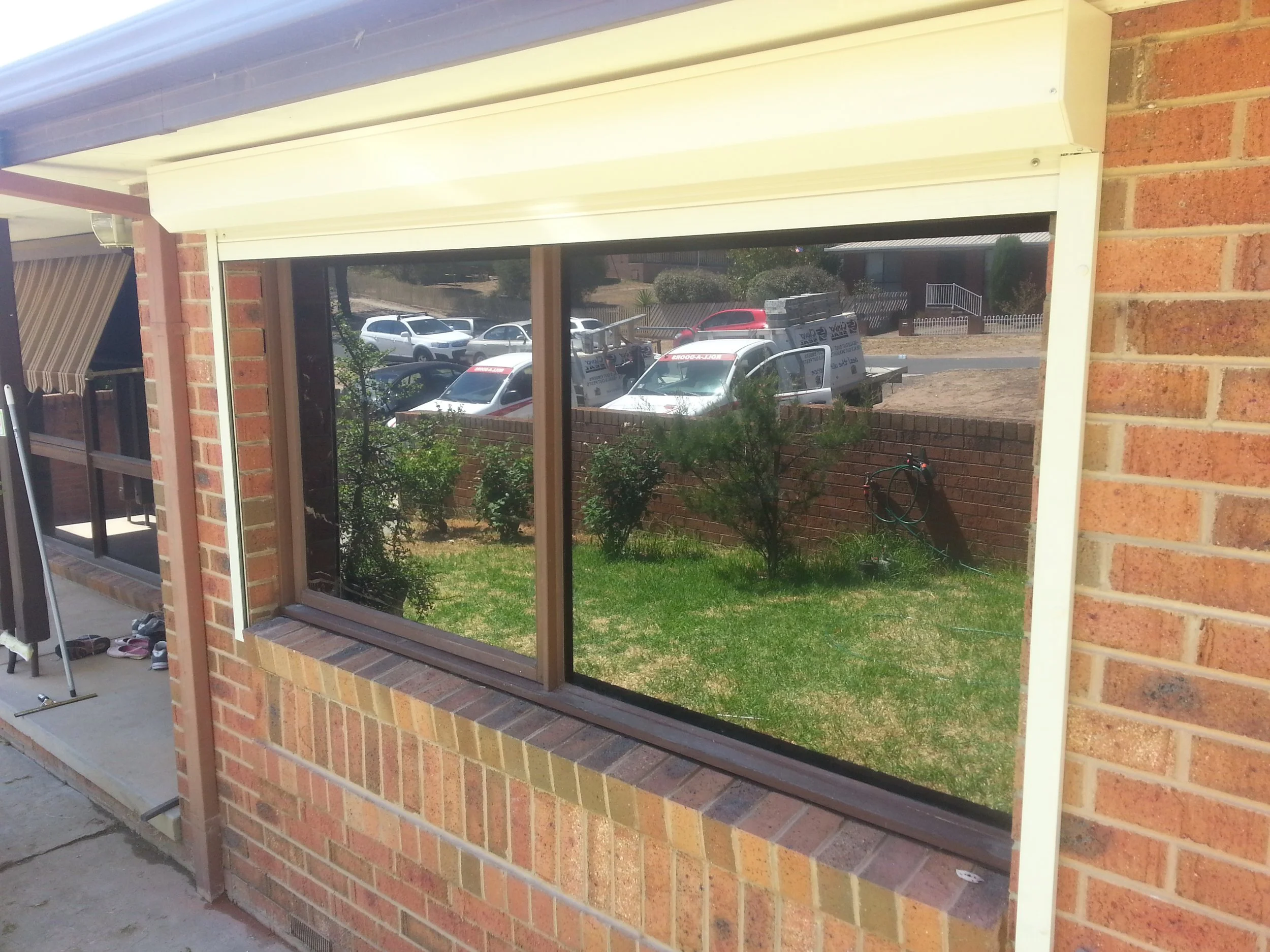 Roller window shutters cream on home.jpg