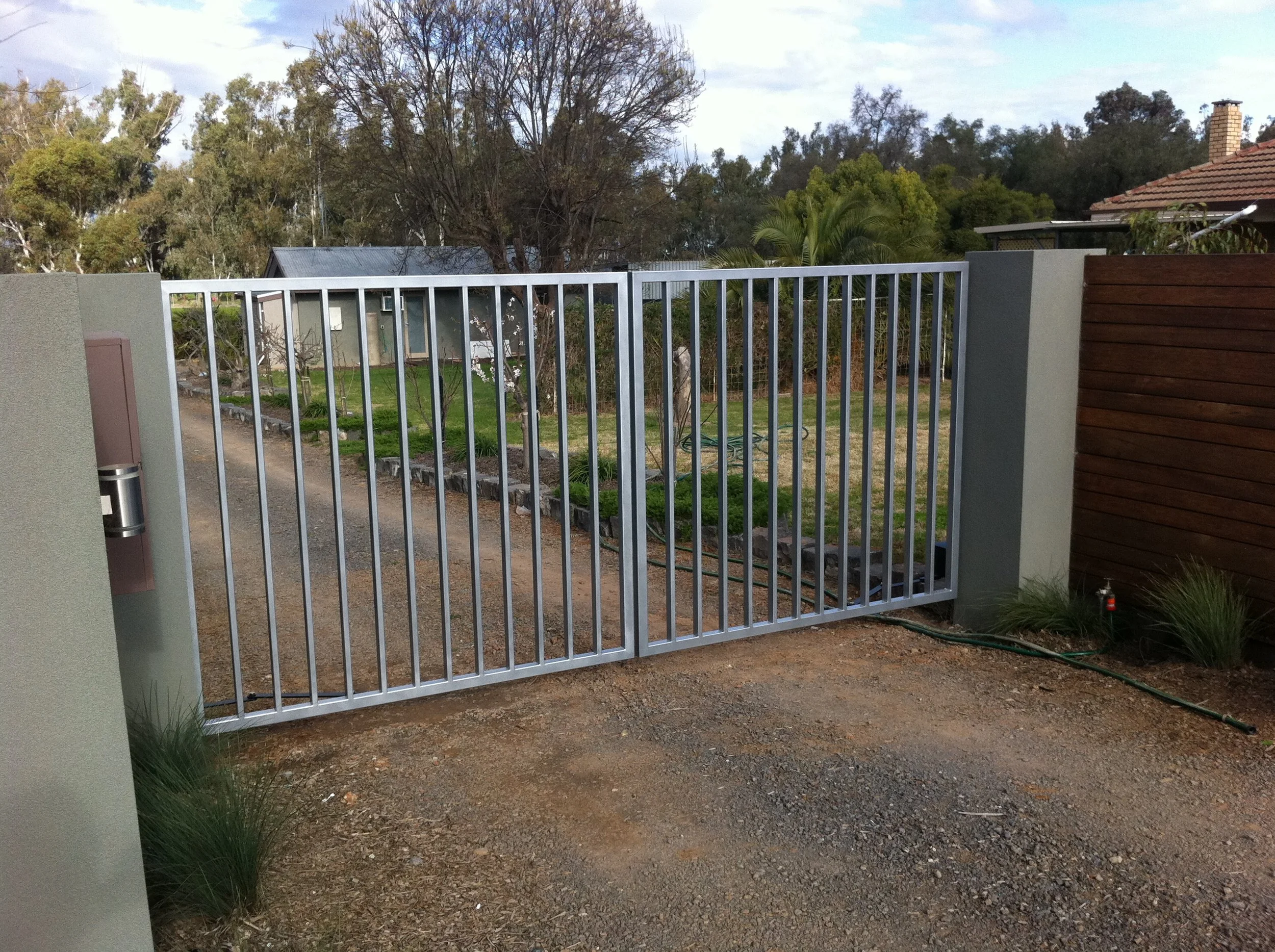 Silver driveway gate on property.jpg