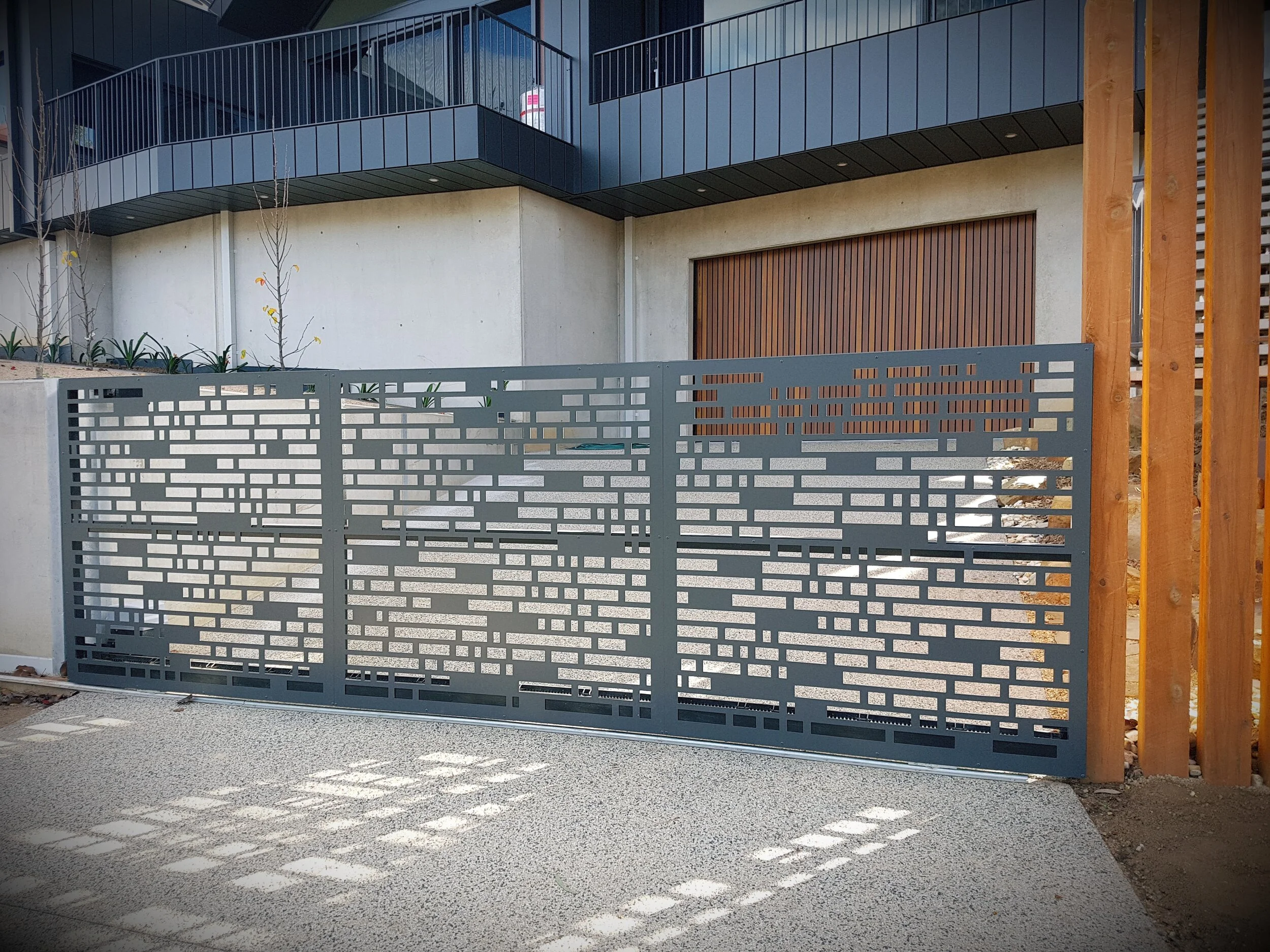 Laser cut automated grey gate.jpg