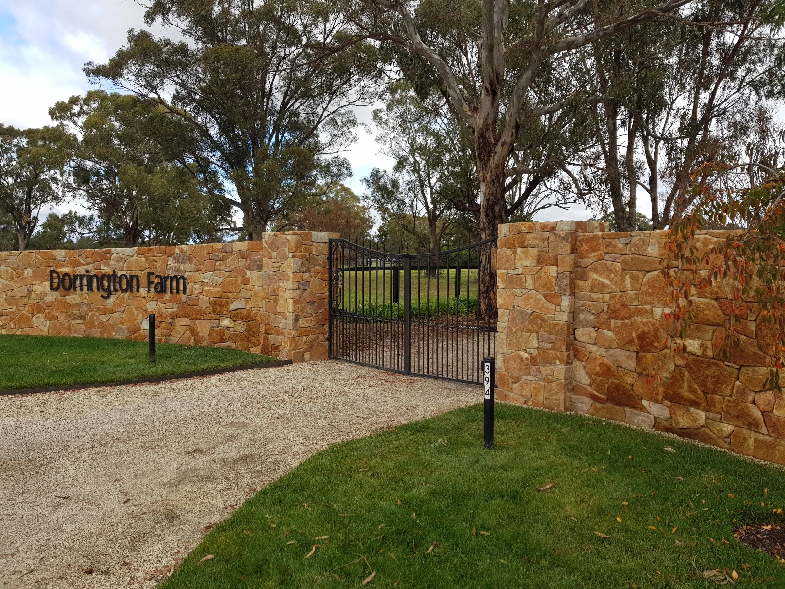 Iron gate on brick fence.jpg