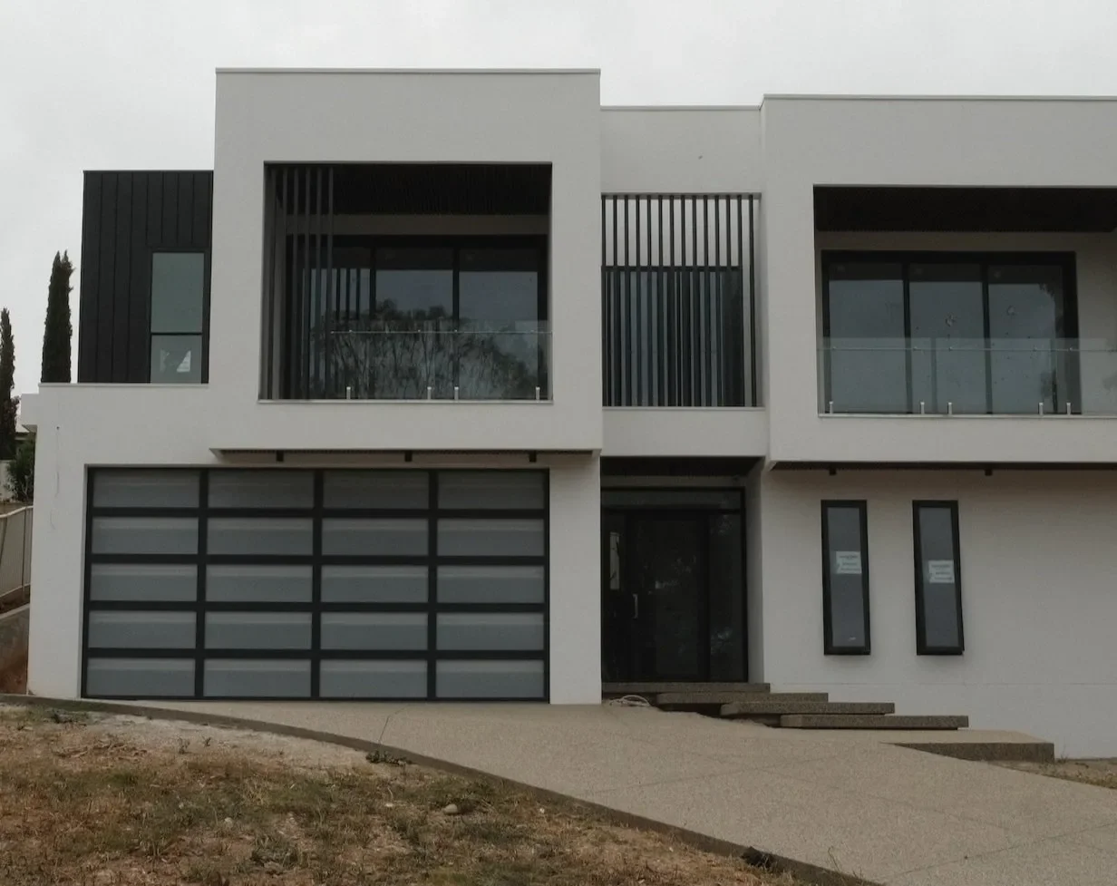 Sectional+garage+door+on+modern+new+home.webp