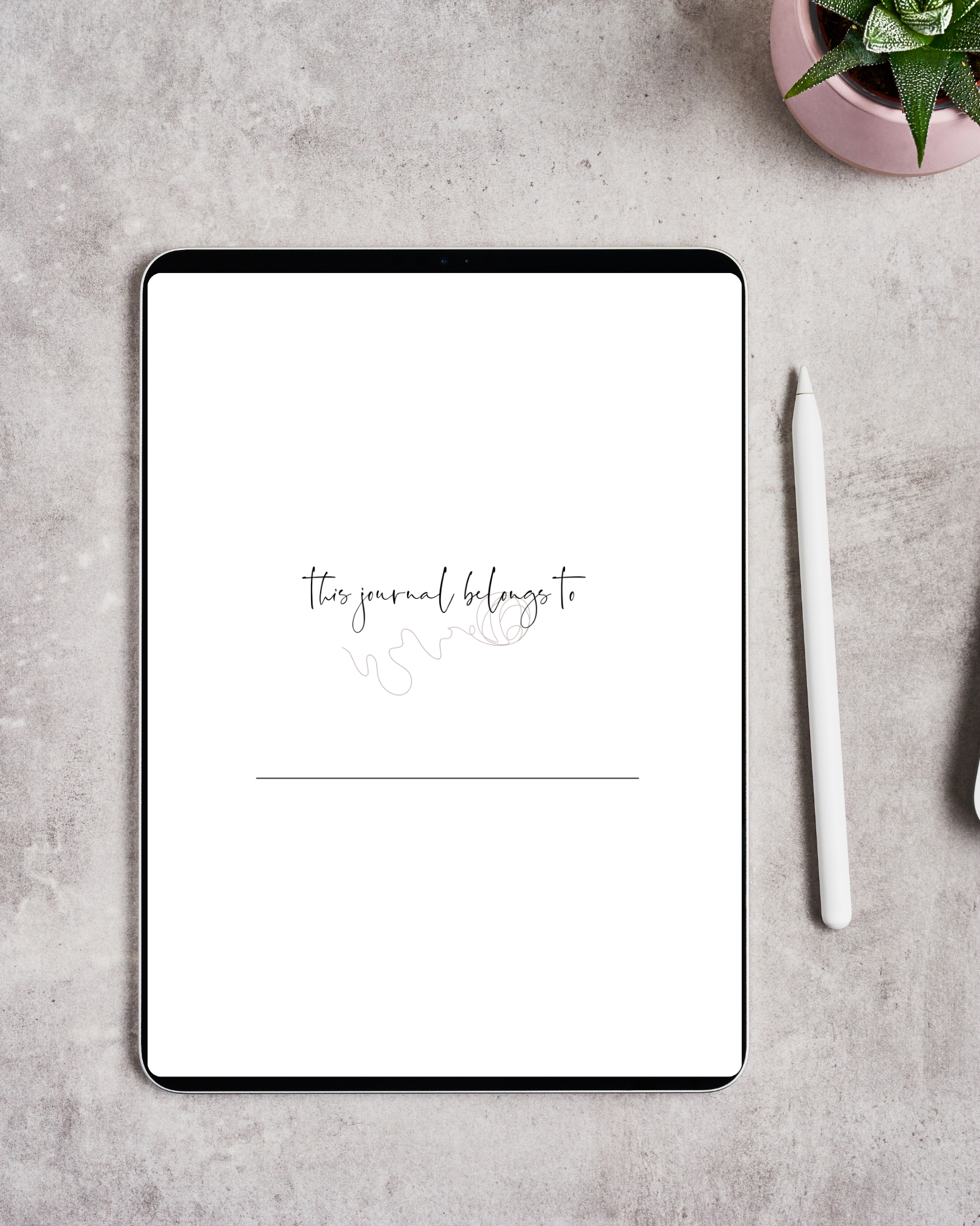 Digital tablet on a light gray textured surface with a white stylus to the right and a potted green succulent plant in a pink pot at the top right corner. The tablet screen displays a minimalistic journal page with the handwritten text "this journal belongs to" and a blank line underneath.