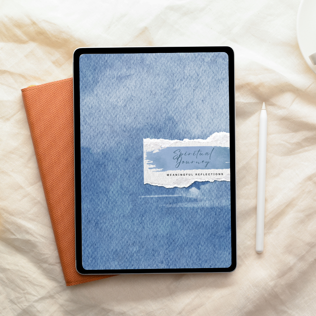 An iPad displaying a cover titled "Spiritual Journey: Meaningful Reflections" on a blue watercolor background, placed beside an orange notebook and a white stylus on a beige fabric surface.